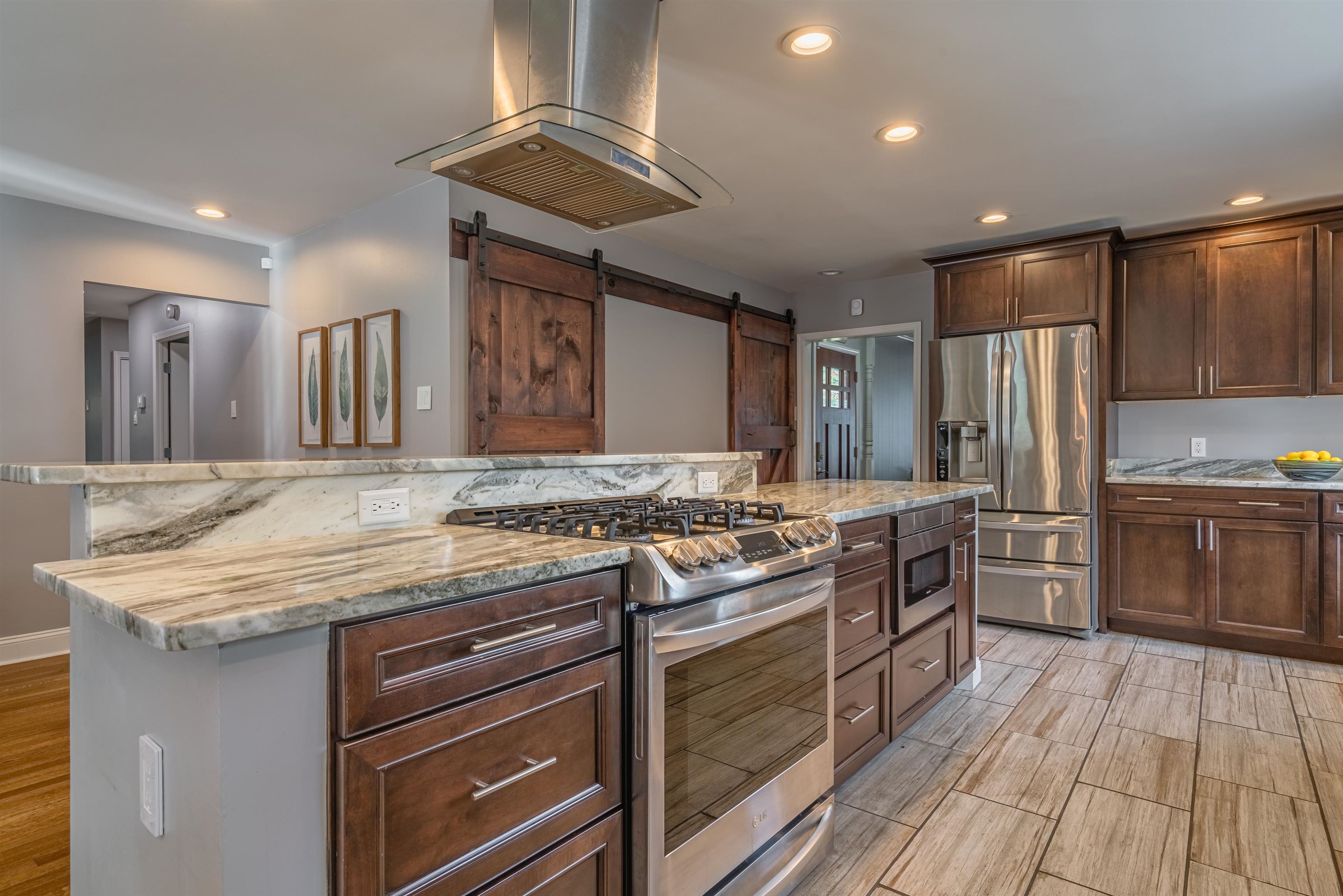 367 Green Acres Road Memphis, TN 38117 - Photo 1 of 27 a kitchen with a stove a sink and a refrigerator