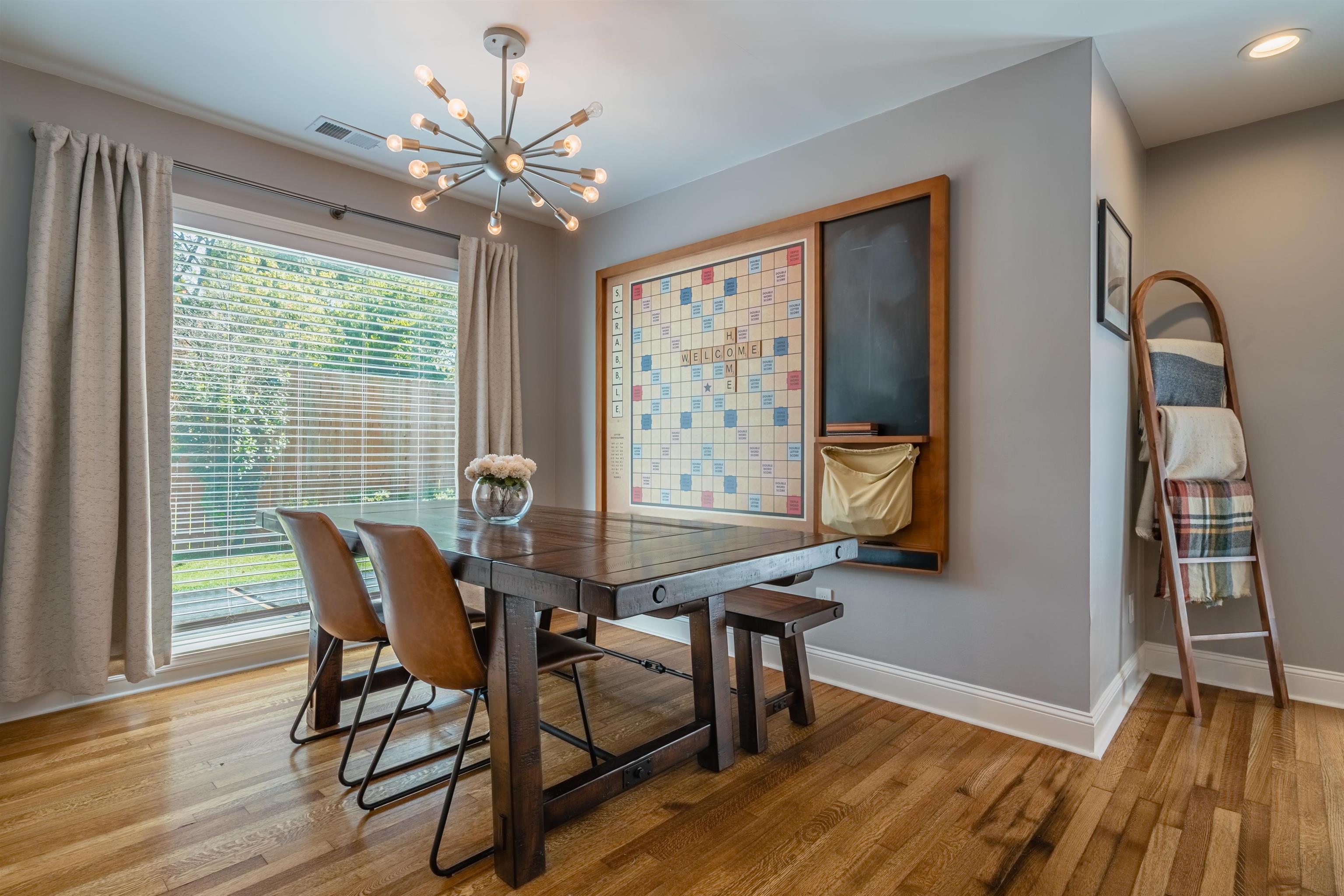 367 Green Acres Road Memphis, TN 38117 - Photo 11 of 27 a view of a dining room with furniture window and wooden floor