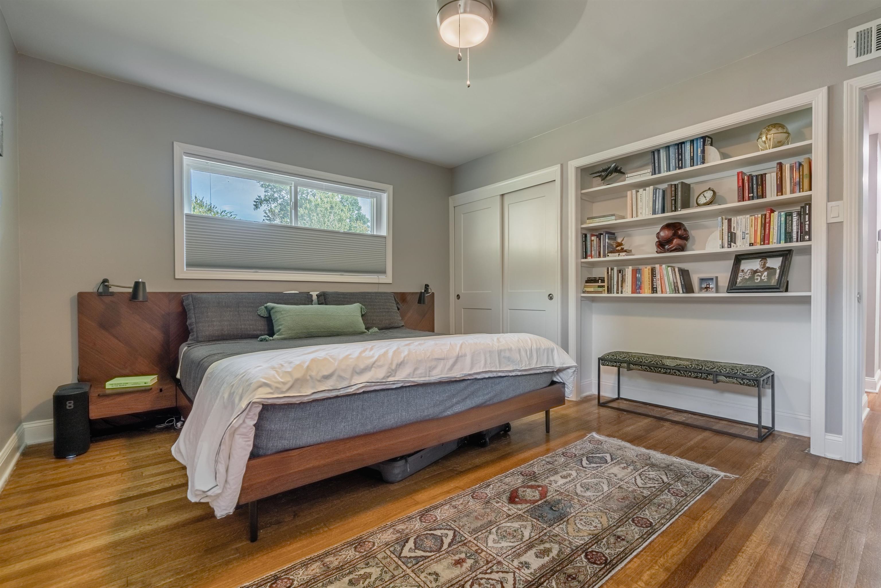 367 Green Acres Road Memphis, TN 38117 - Photo 16 of 27 a bedroom with a bed and a book shelf