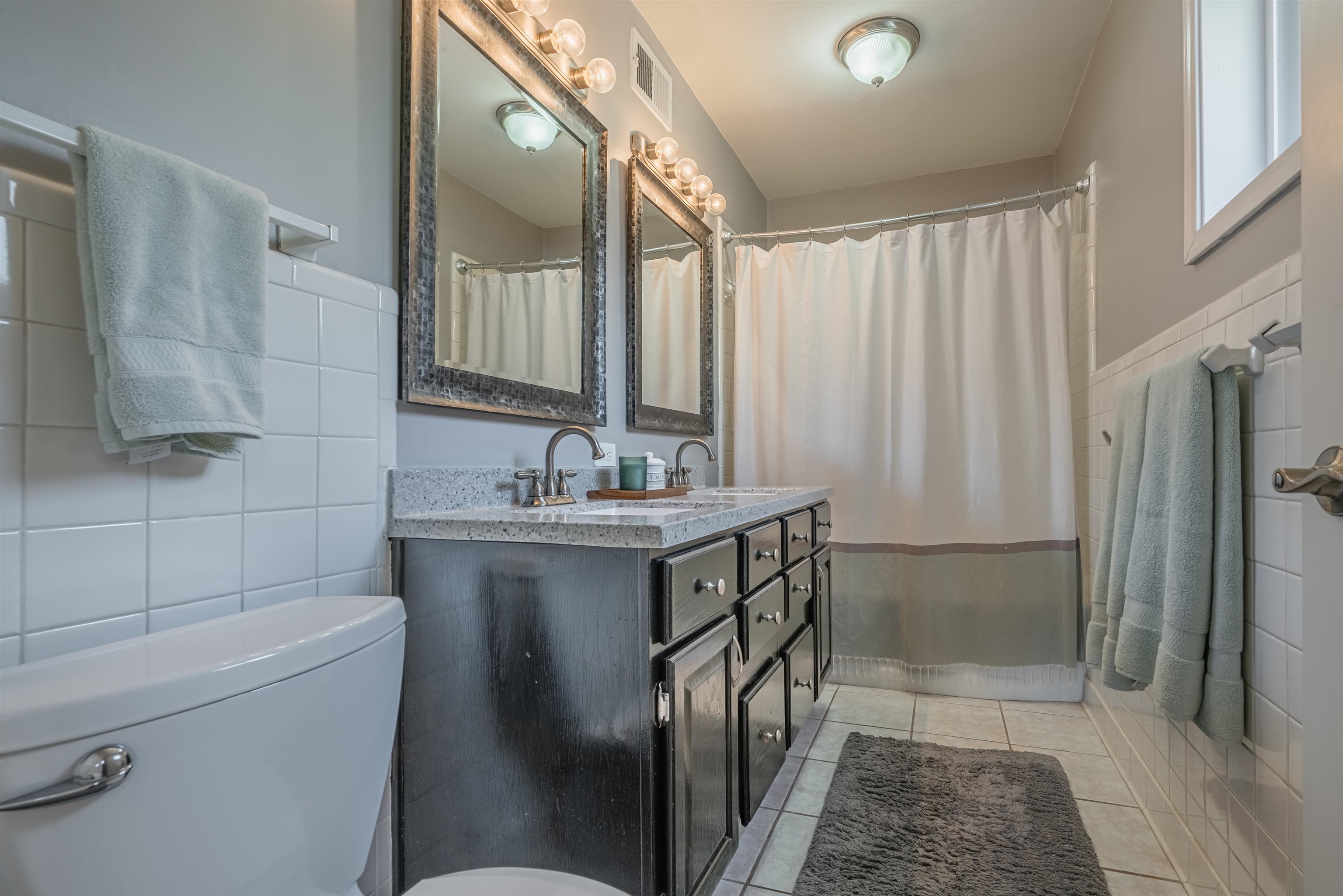 367 Green Acres Road Memphis, TN 38117 - Photo 17 of 27 a bathroom with a sink a toilet and shower