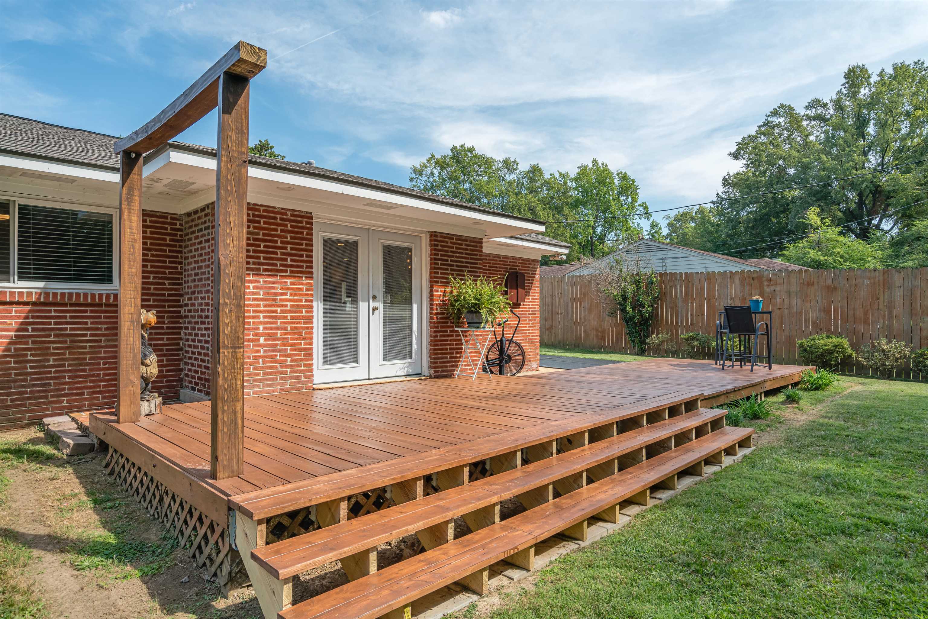 367 Green Acres Road Memphis, TN 38117 - Photo 25 of 27 a view of a backyard with a deck and wooden floor