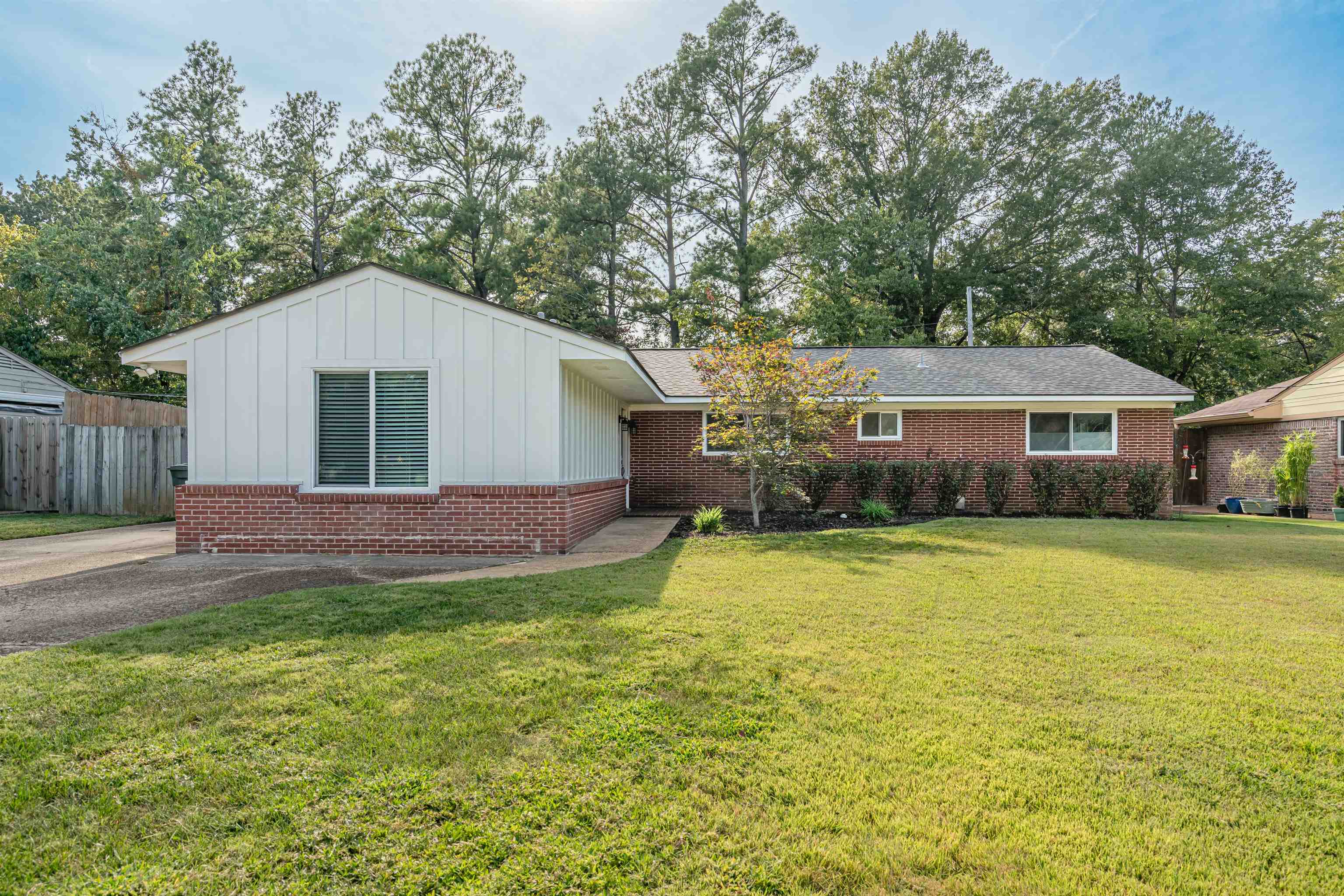 367 Green Acres Road Memphis, TN 38117 - Photo 5 of 27 a front view of house with yard and trees in the background