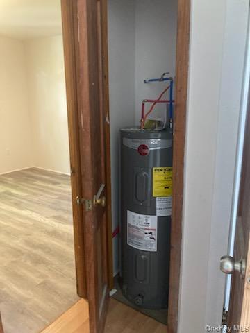 42 Hillside Avenue Monticello, NY 12701 - Photo 12 of 12 a bathroom with a sink and a mirror