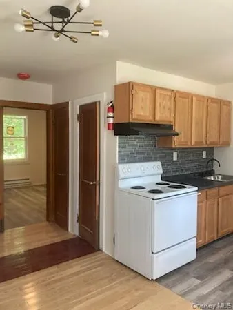 a kitchen with stainless steel appliances granite countertop a stove and a refrigerator