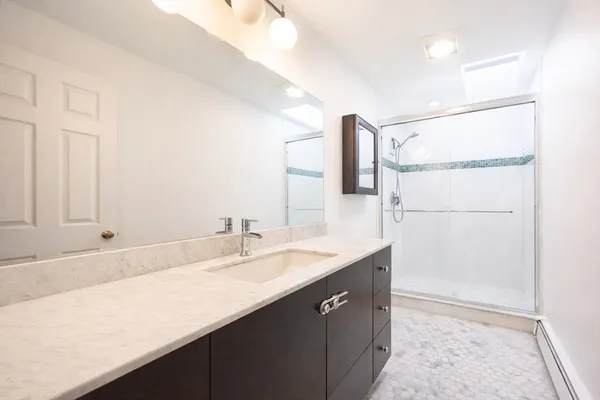 a bathroom with a sink and a mirror