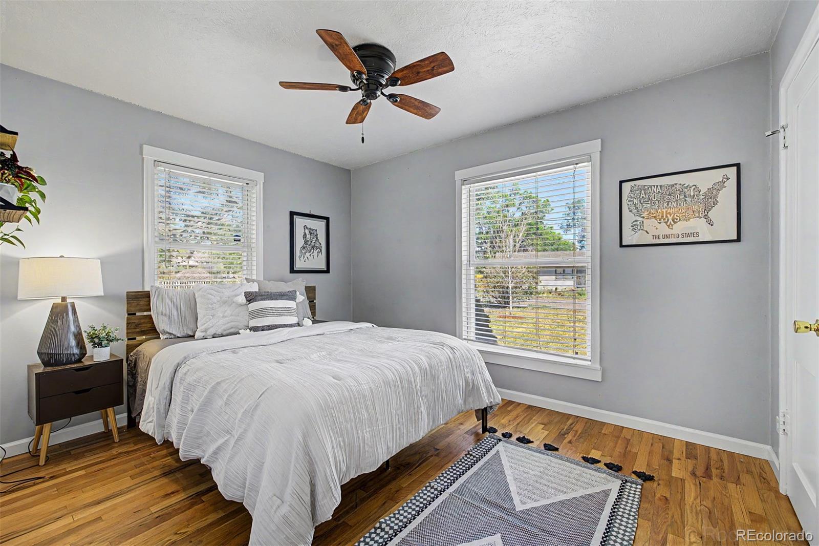 6790 West 48th Avenue Wheat Ridge, CO 80033 - Photo 13 of 30 a bedroom with a bed and a window