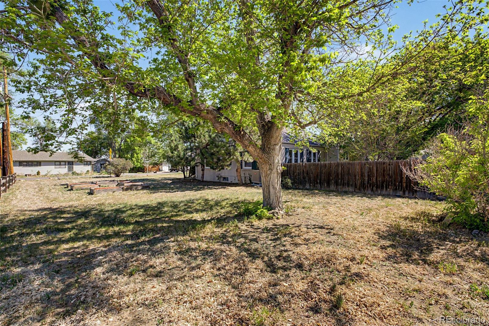 6790 West 48th Avenue Wheat Ridge, CO 80033 - Photo 29 of 30 a backyard of a house with lots of green space