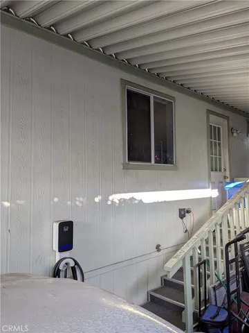 a view of a hallway with seating area