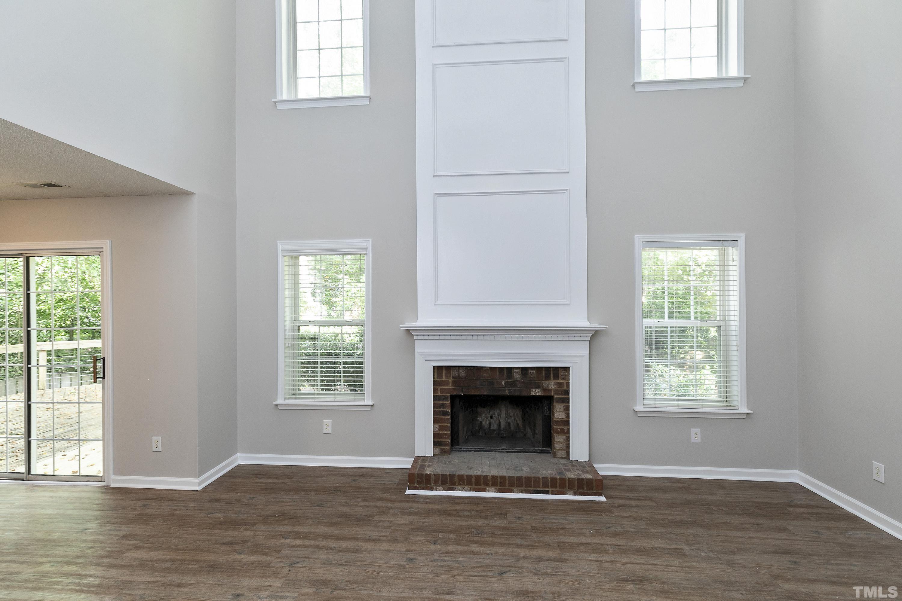 613 Branchview Drive Durham, NC 27713 - Photo 15 of 40 a view of an empty room with wooden floor and a window