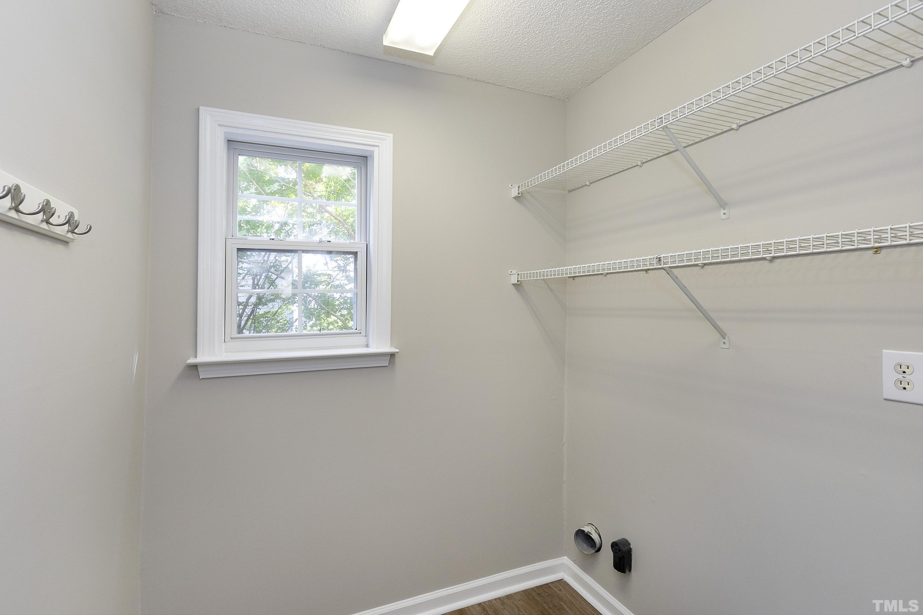 613 Branchview Drive Durham, NC 27713 - Photo 19 of 40 a bathroom with a window and dryer