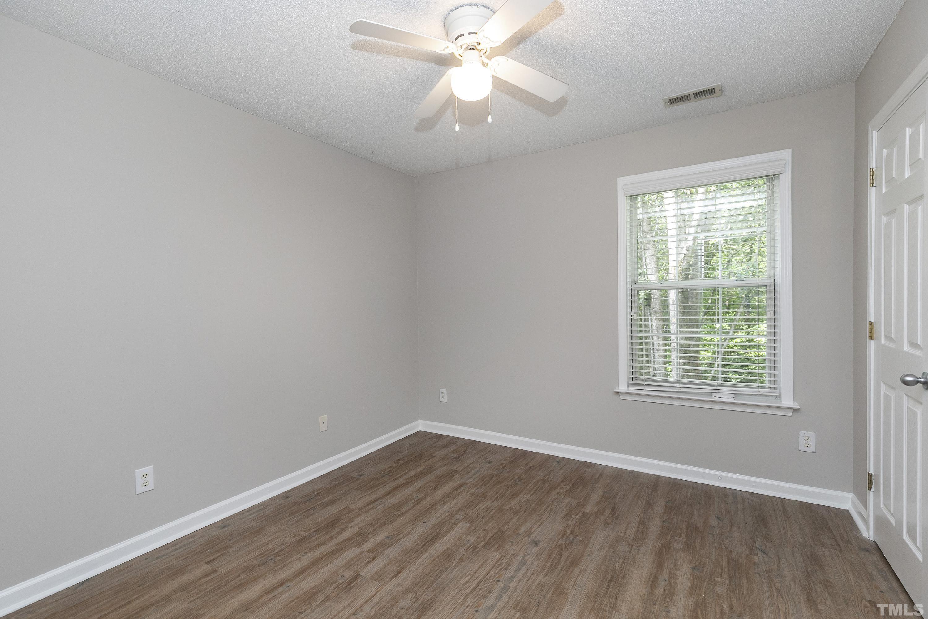 613 Branchview Drive Durham, NC 27713 - Photo 27 of 40 wooden floor in an empty room with a window