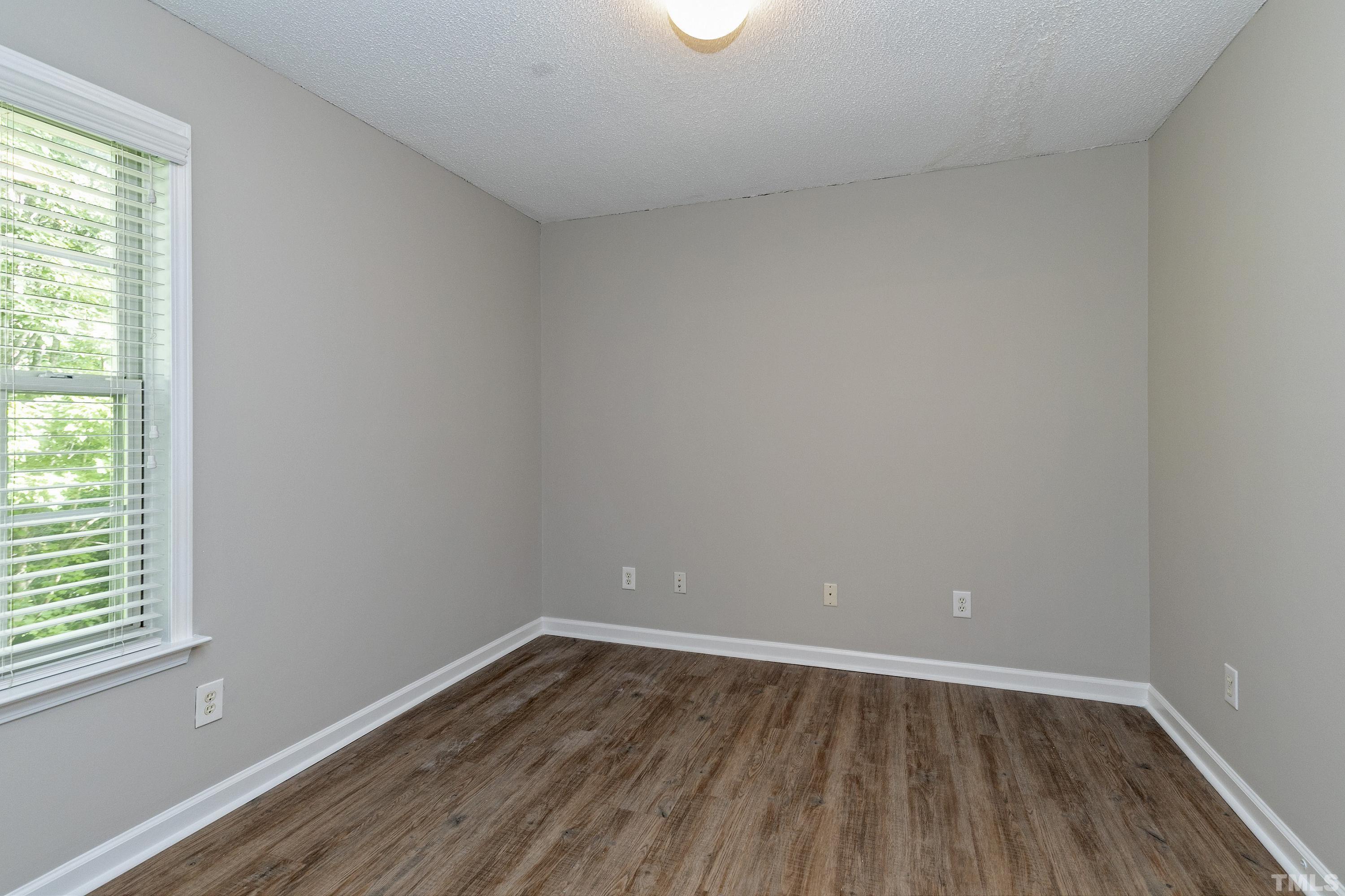613 Branchview Drive Durham, NC 27713 - Photo 29 of 40 wooden floor in an empty room with a window
