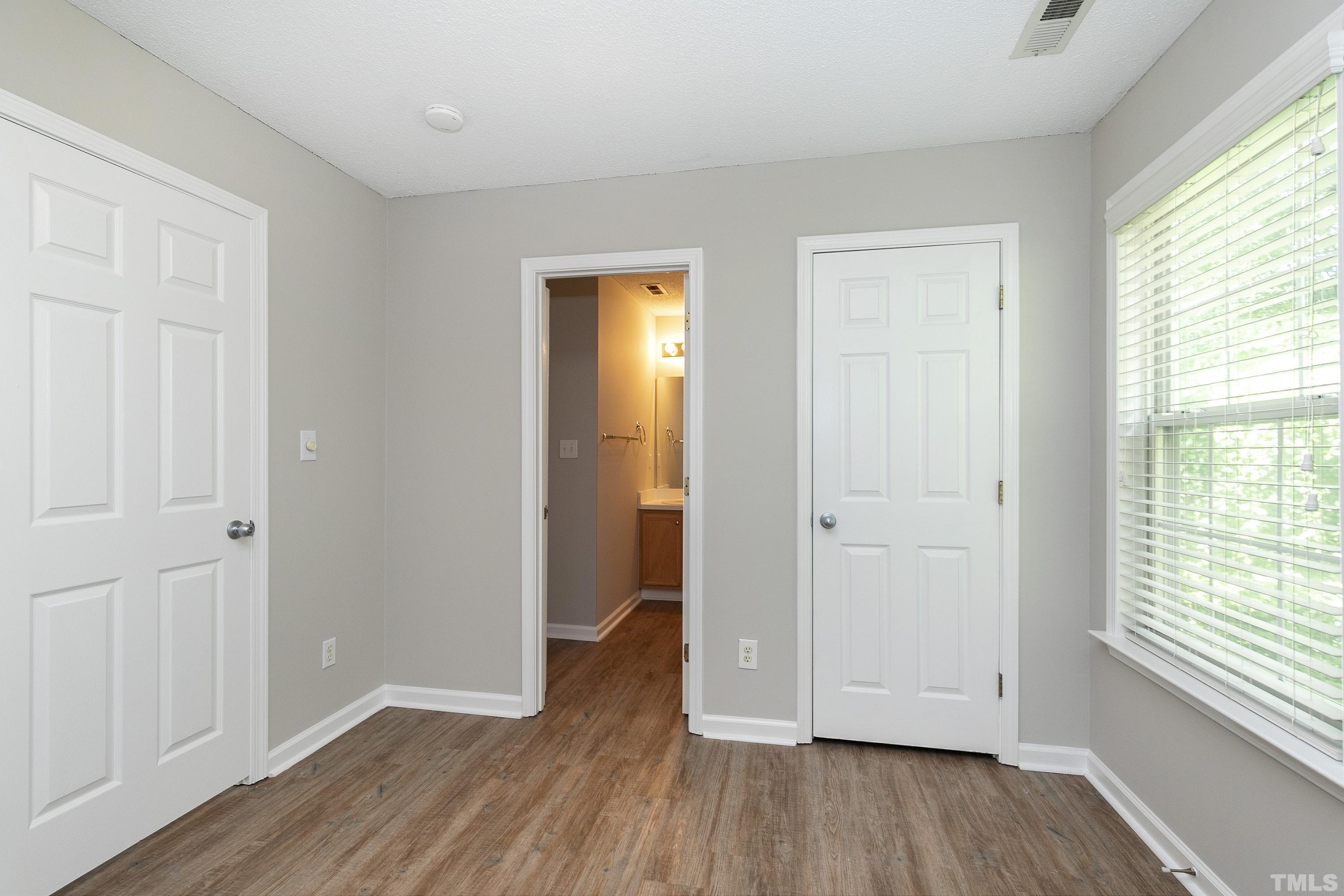 613 Branchview Drive Durham, NC 27713 - Photo 30 of 40 a view of empty room with wooden floor and fan