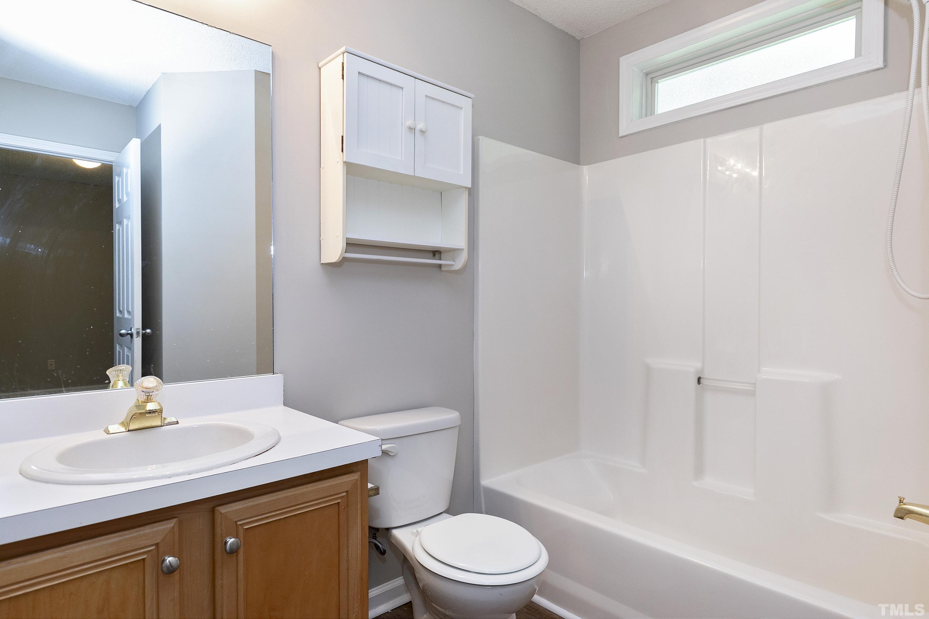 613 Branchview Drive Durham, NC 27713 - Photo 31 of 40 a bathroom with a sink toilet and shower