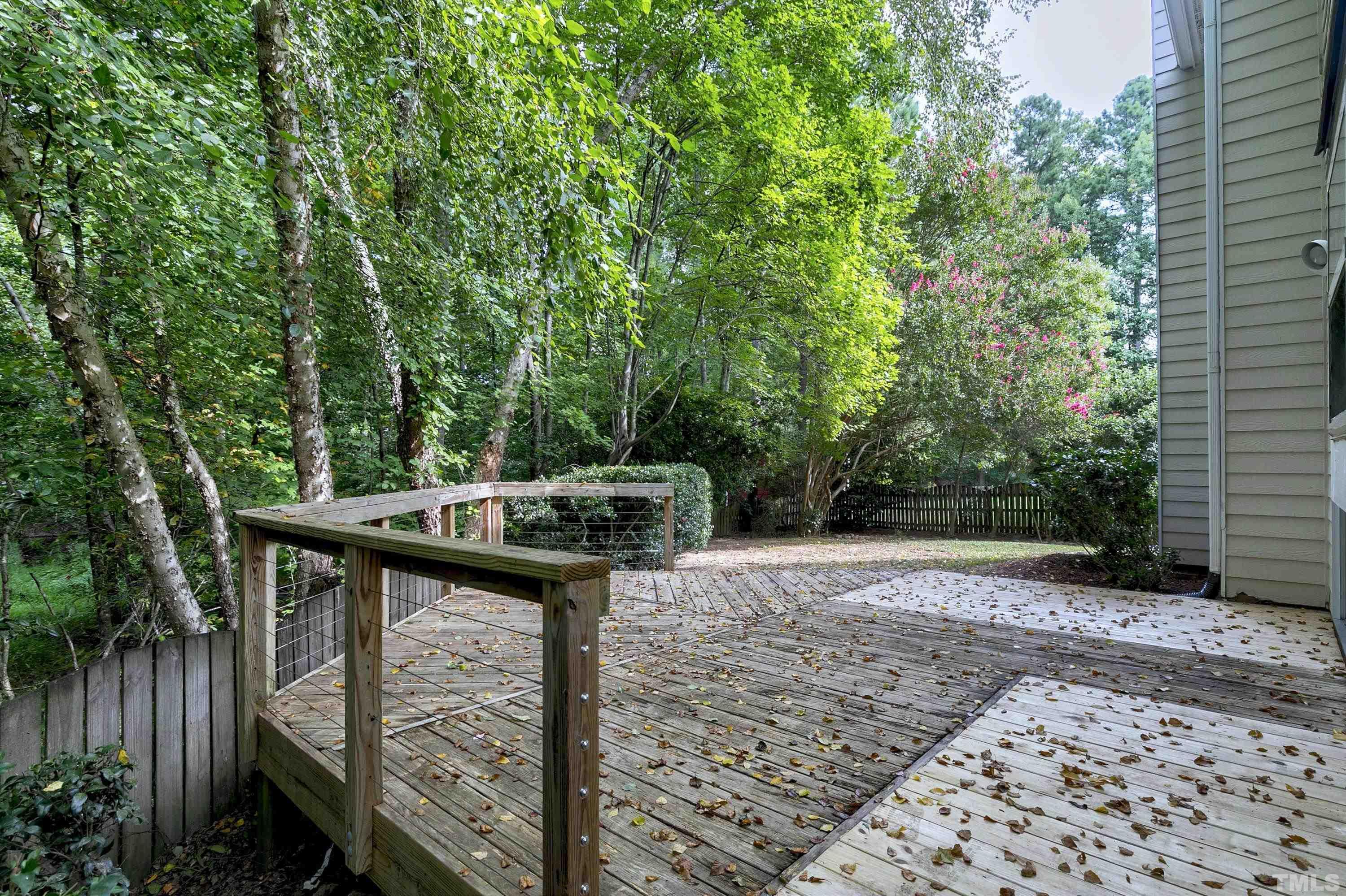 613 Branchview Drive Durham, NC 27713 - Photo 33 of 40 a view of a wooden deck and a yard