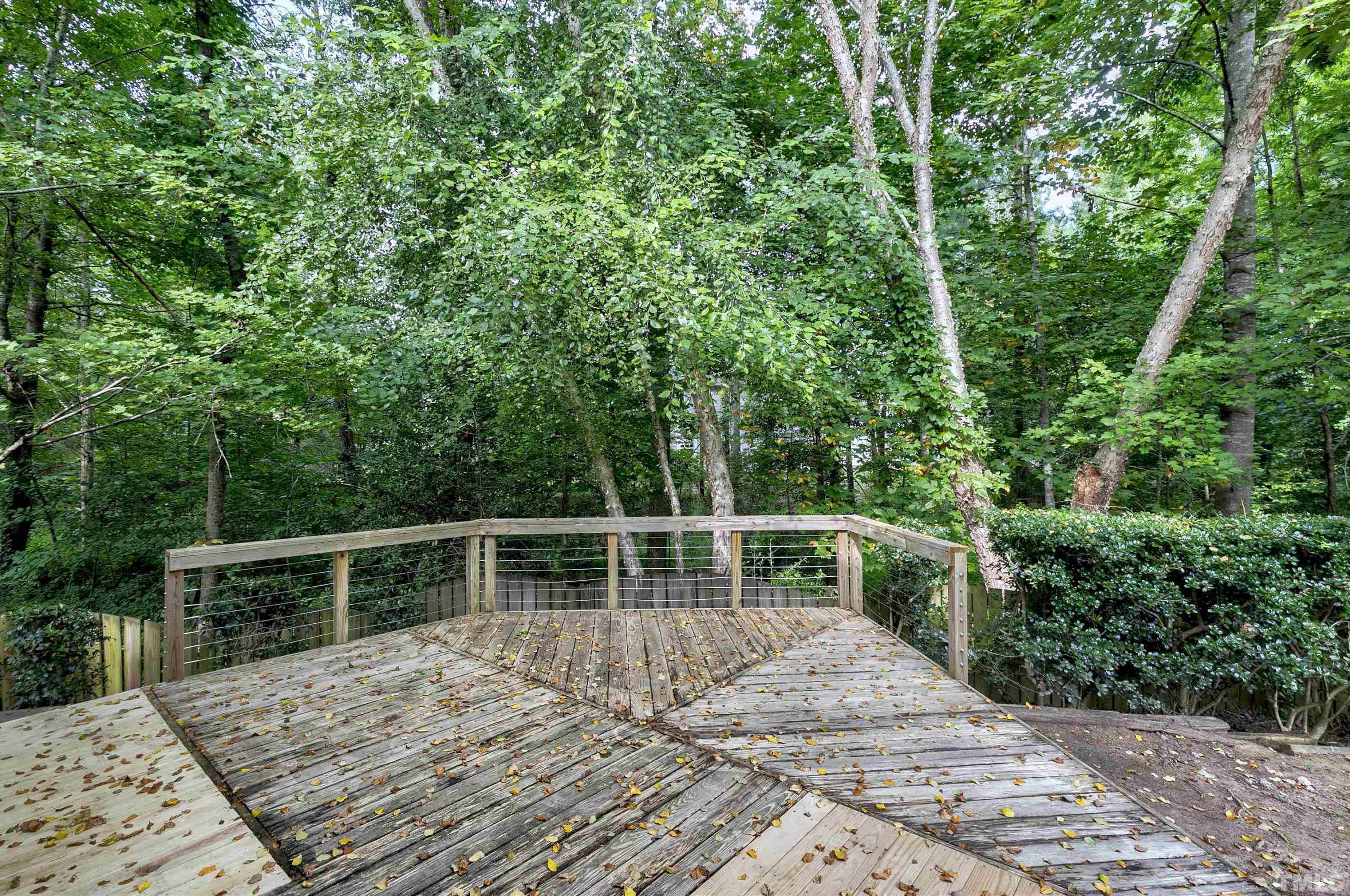 613 Branchview Drive Durham, NC 27713 - Photo 34 of 40 a view of balcony with deck and trees