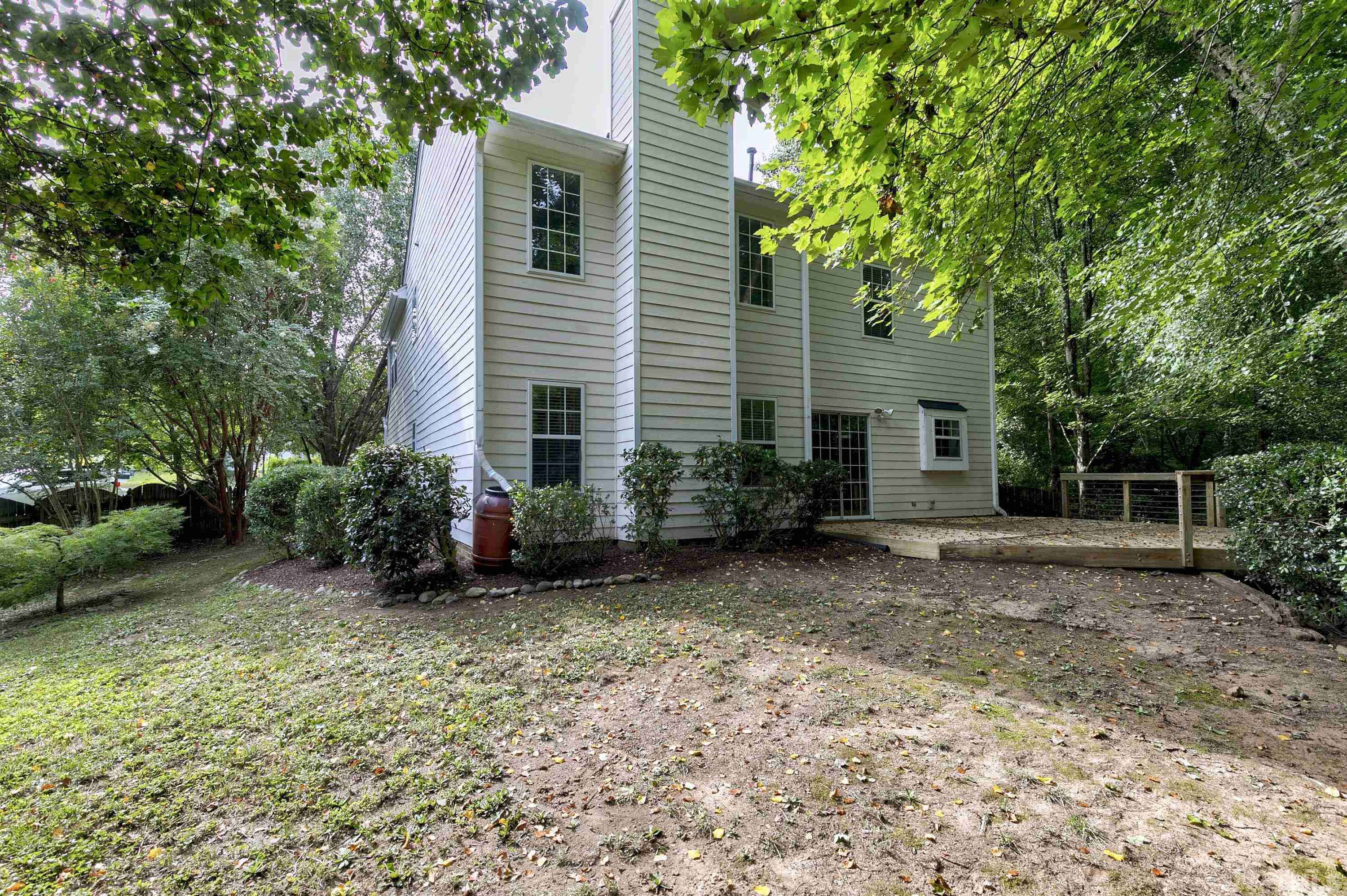 613 Branchview Drive Durham, NC 27713 - Photo 37 of 40 a view of a house with a yard and potted plants
