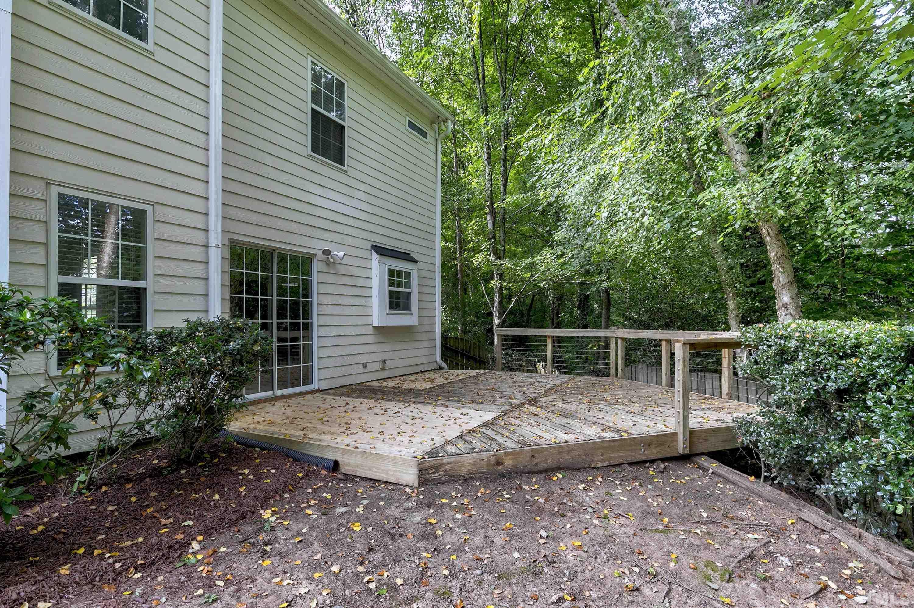 613 Branchview Drive Durham, NC 27713 - Photo 38 of 40 a view of a house with a backyard