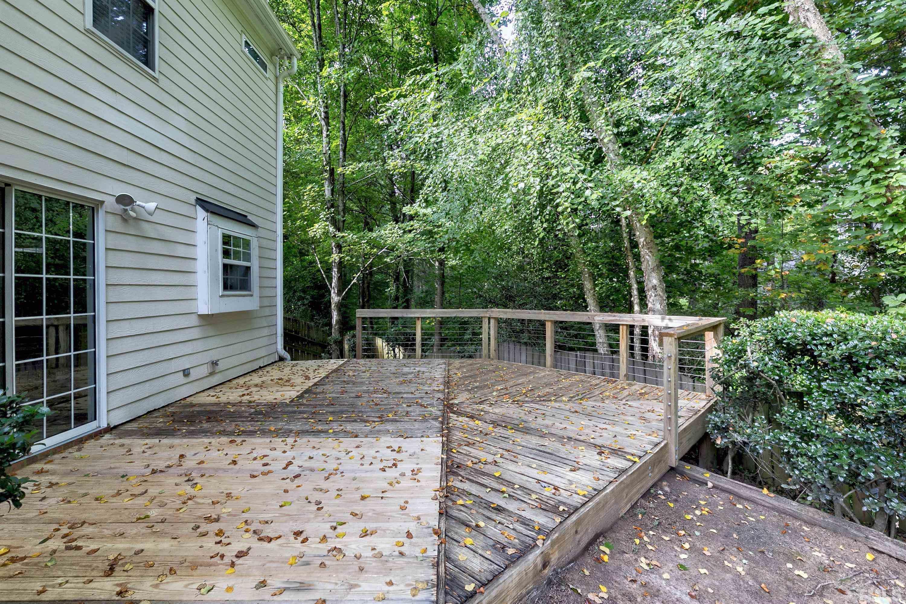 613 Branchview Drive Durham, NC 27713 - Photo 39 of 40 a view of a wooden deck and a backyard