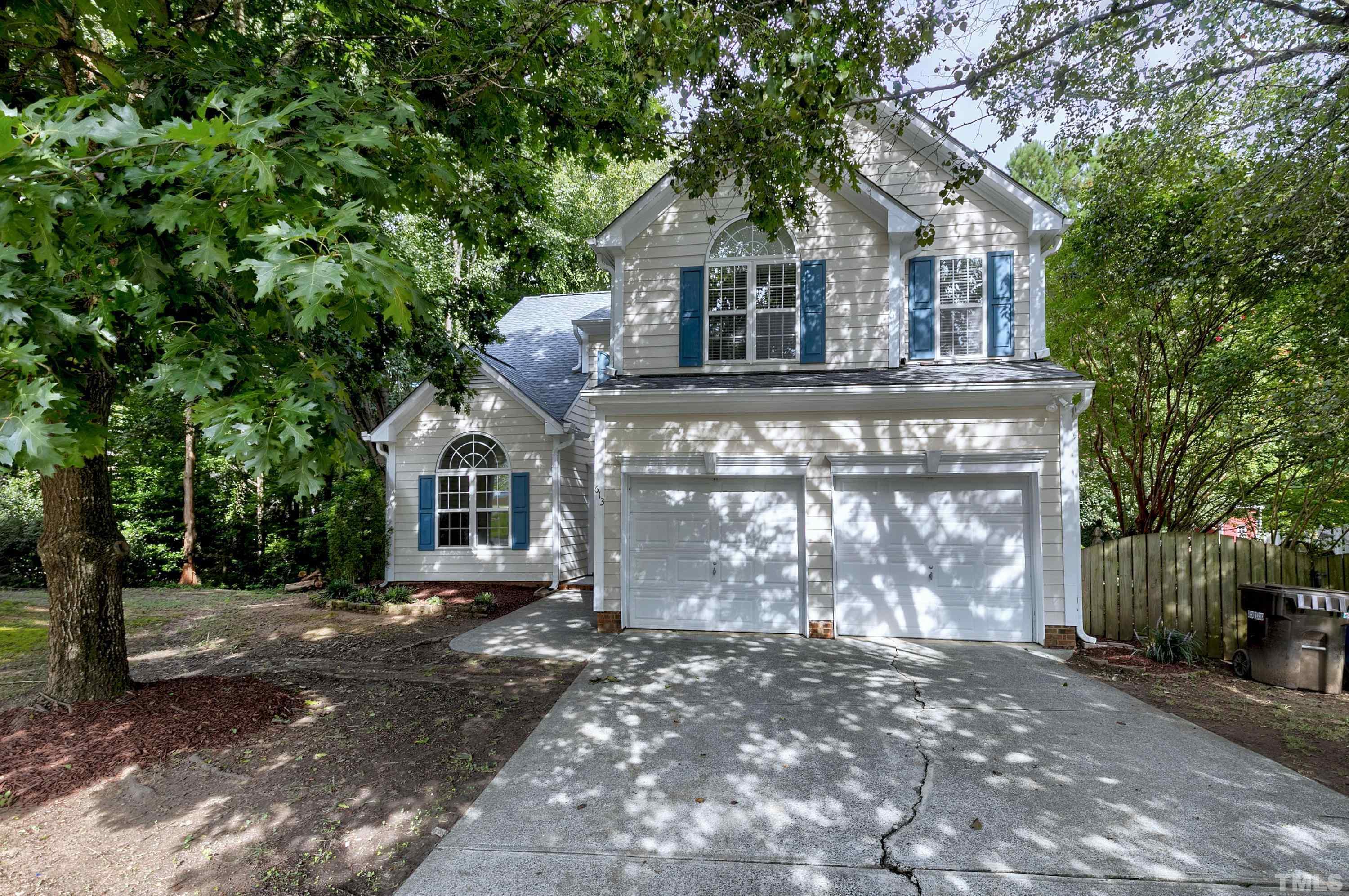613 Branchview Drive Durham, NC 27713 - Photo 40 of 40 a front view of a house with a yard and garage