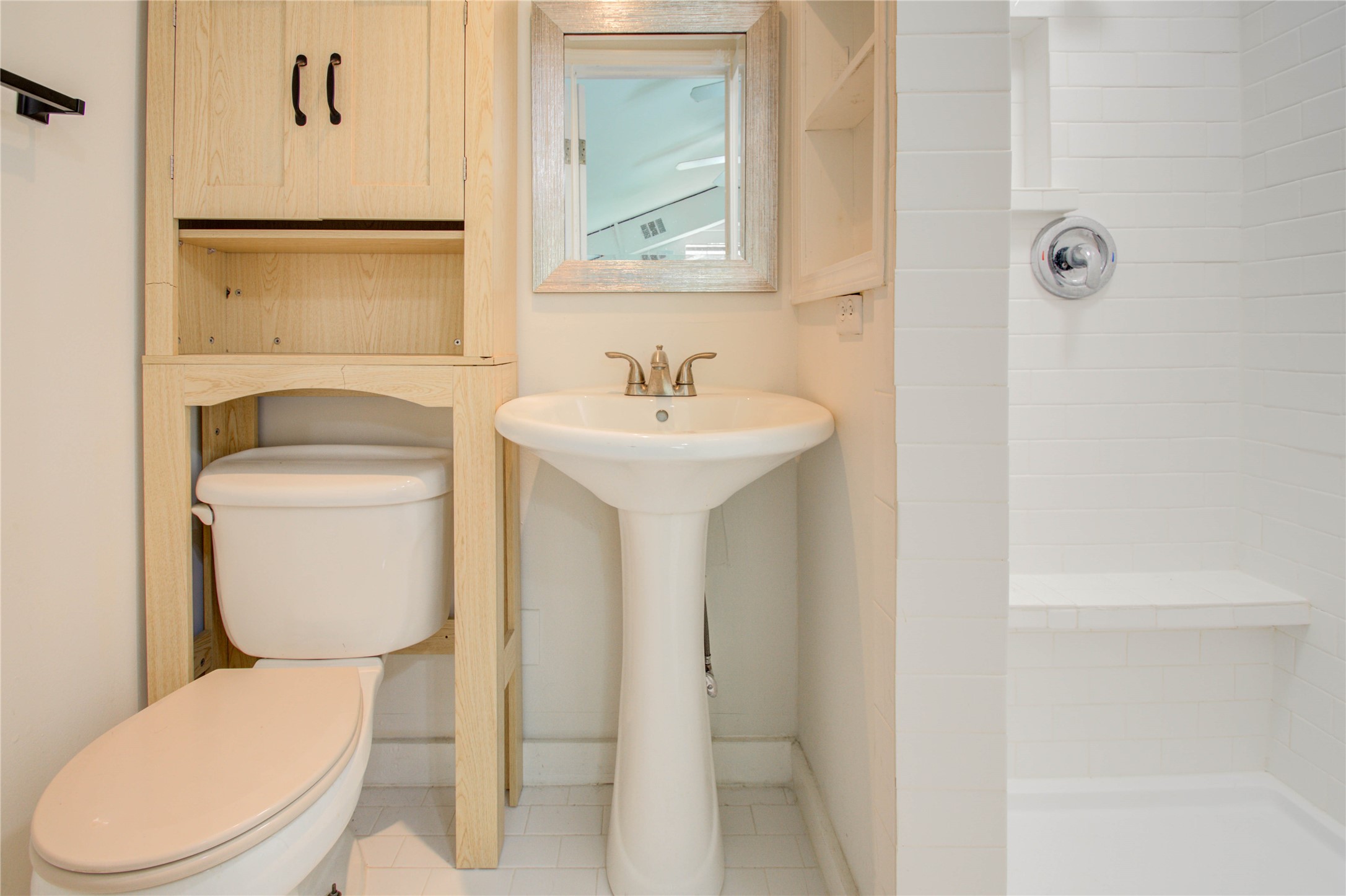 5311 Palmetto Street, Unit C Houston, TX 77081 - Photo 14 of 20 a bathroom with a toilet a sink and mirror