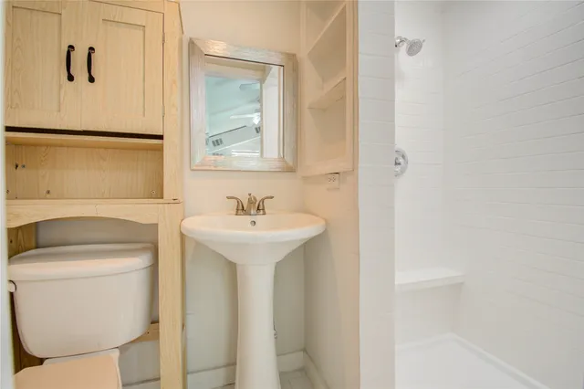 a view of a hallway with windows