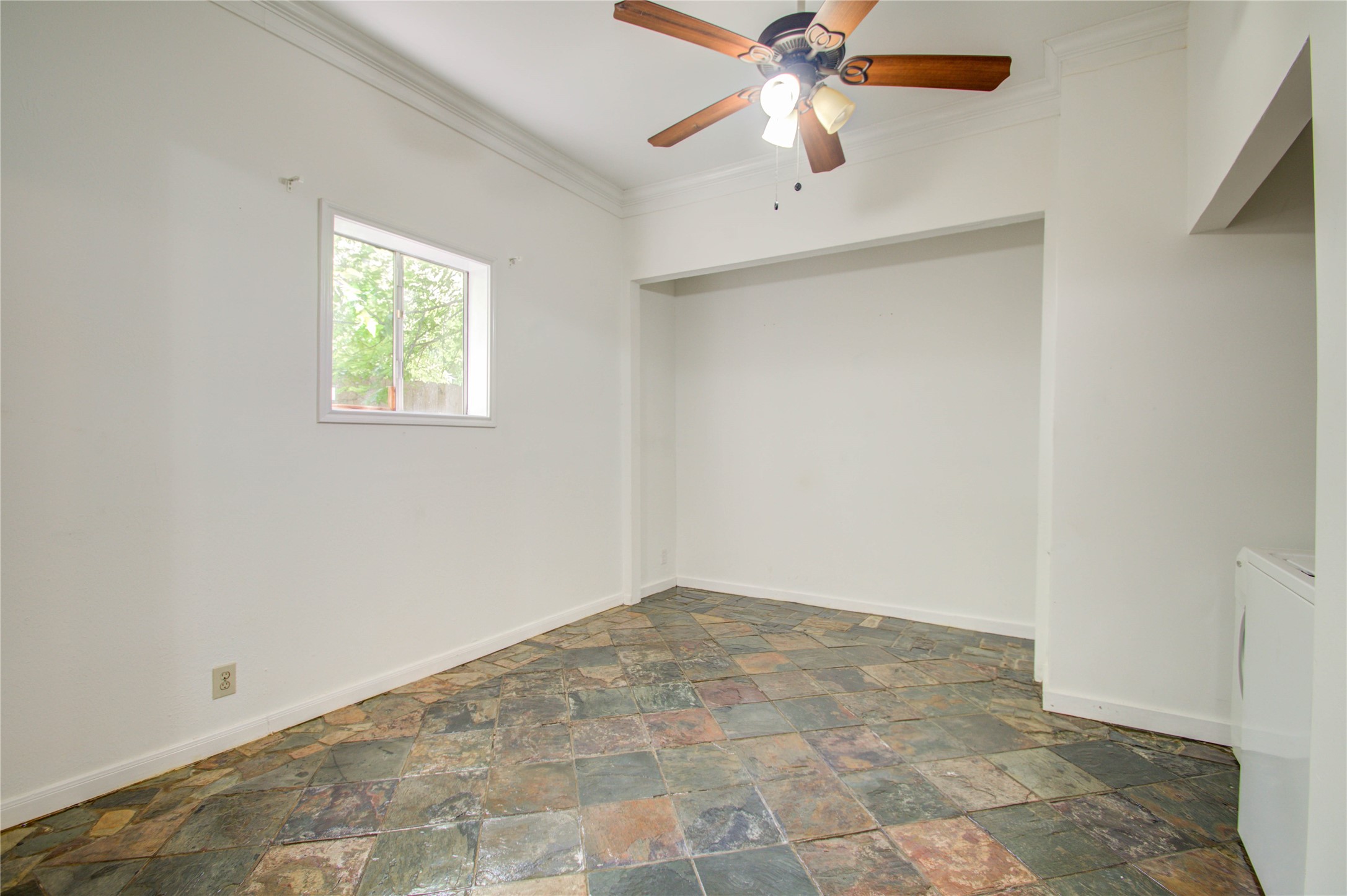 5311 Palmetto Street, Unit C Houston, TX 77081 - Photo 8 of 20 an empty room with windows and fan