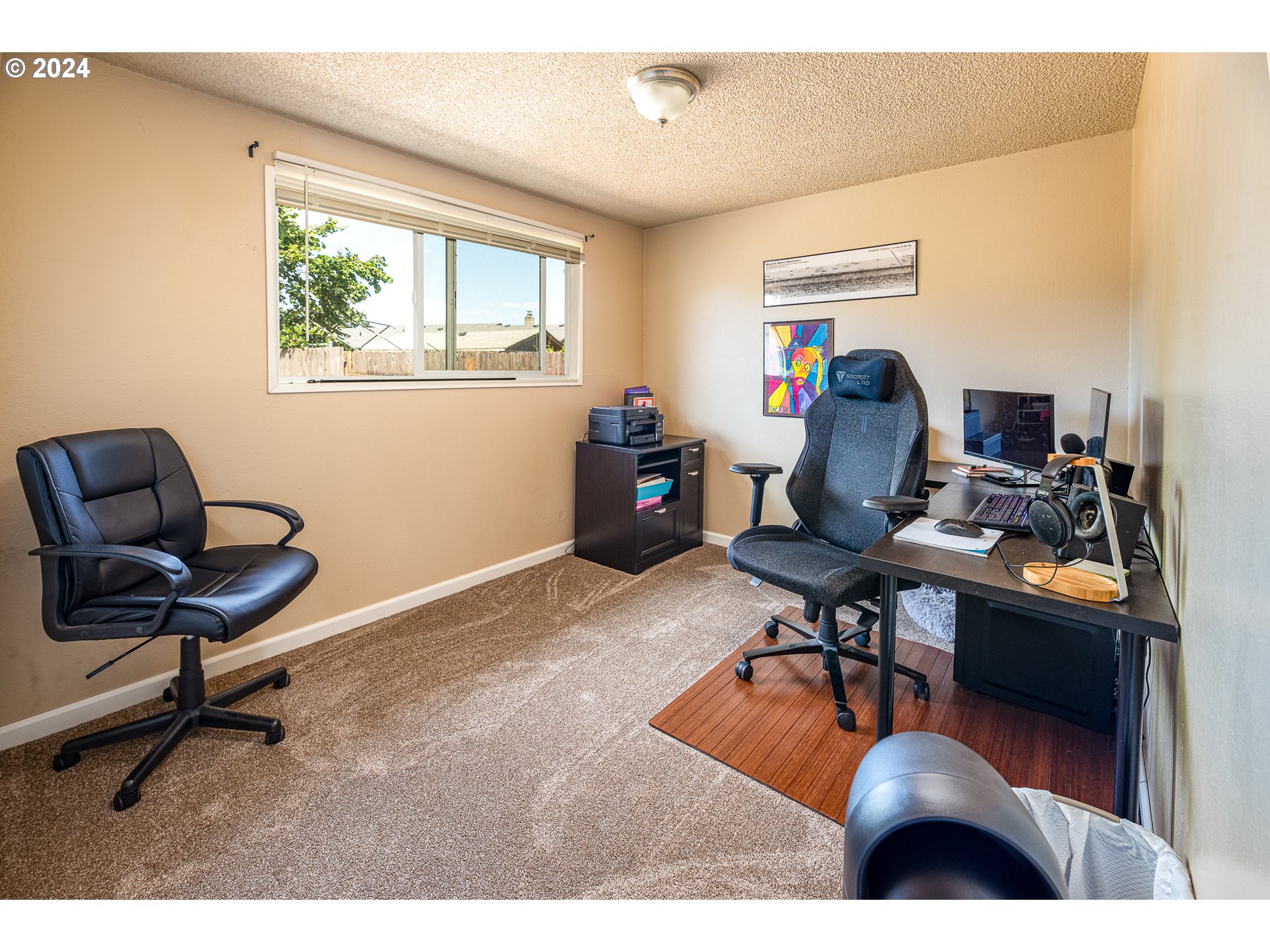 3870 Richland Street Springfield, OR 97478 - Photo 38 of 41 a view of a workspace with furniture and a window