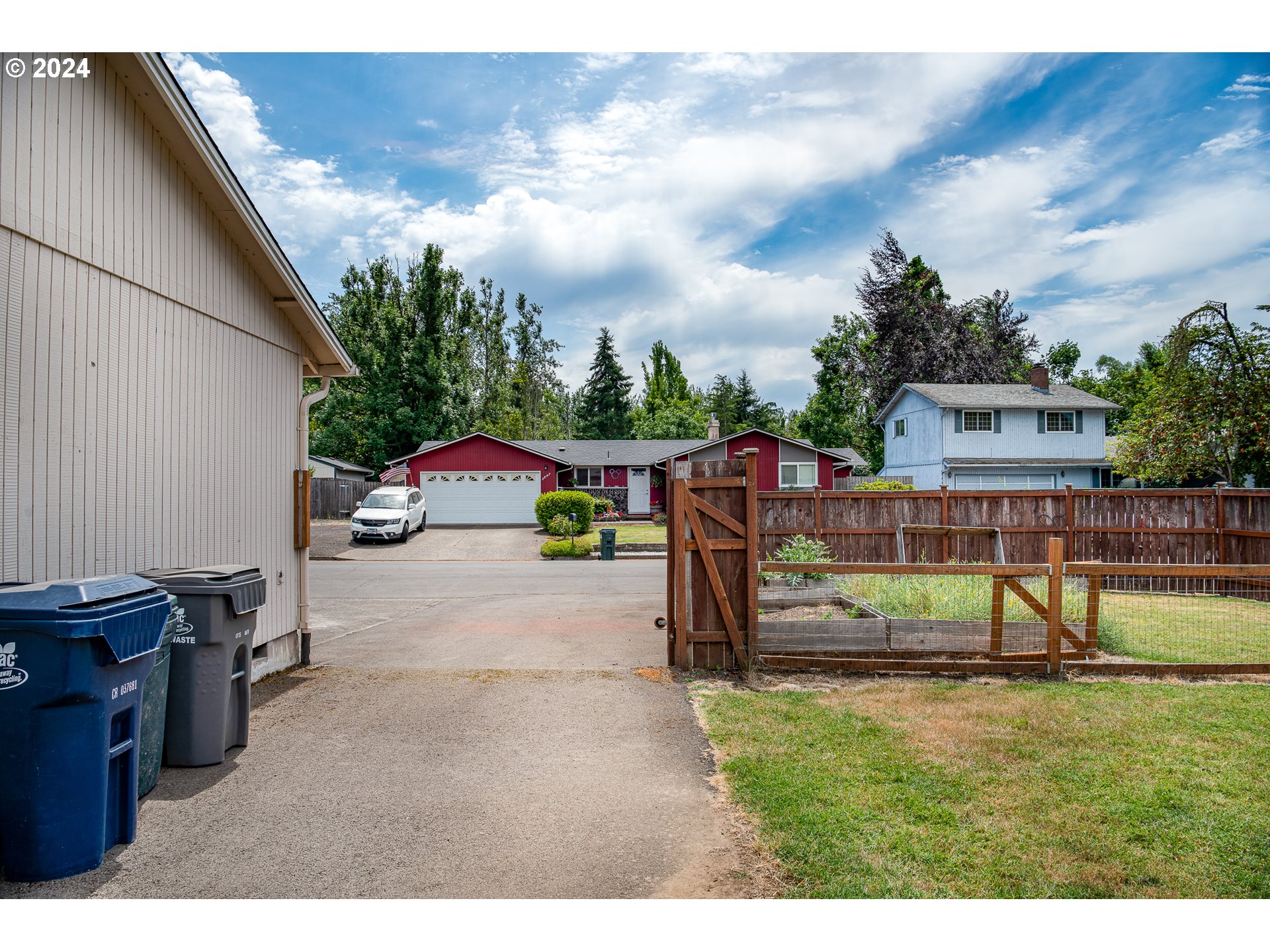 3870 Richland Street Springfield, OR 97478 - Photo 4 of 41 a view of a backyard with swings and slides