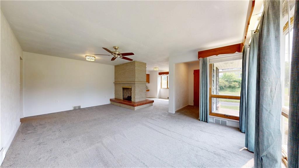 721 Herman Road Butler, PA 16002 - Photo 10 of 32 a view of empty room with a fireplace
