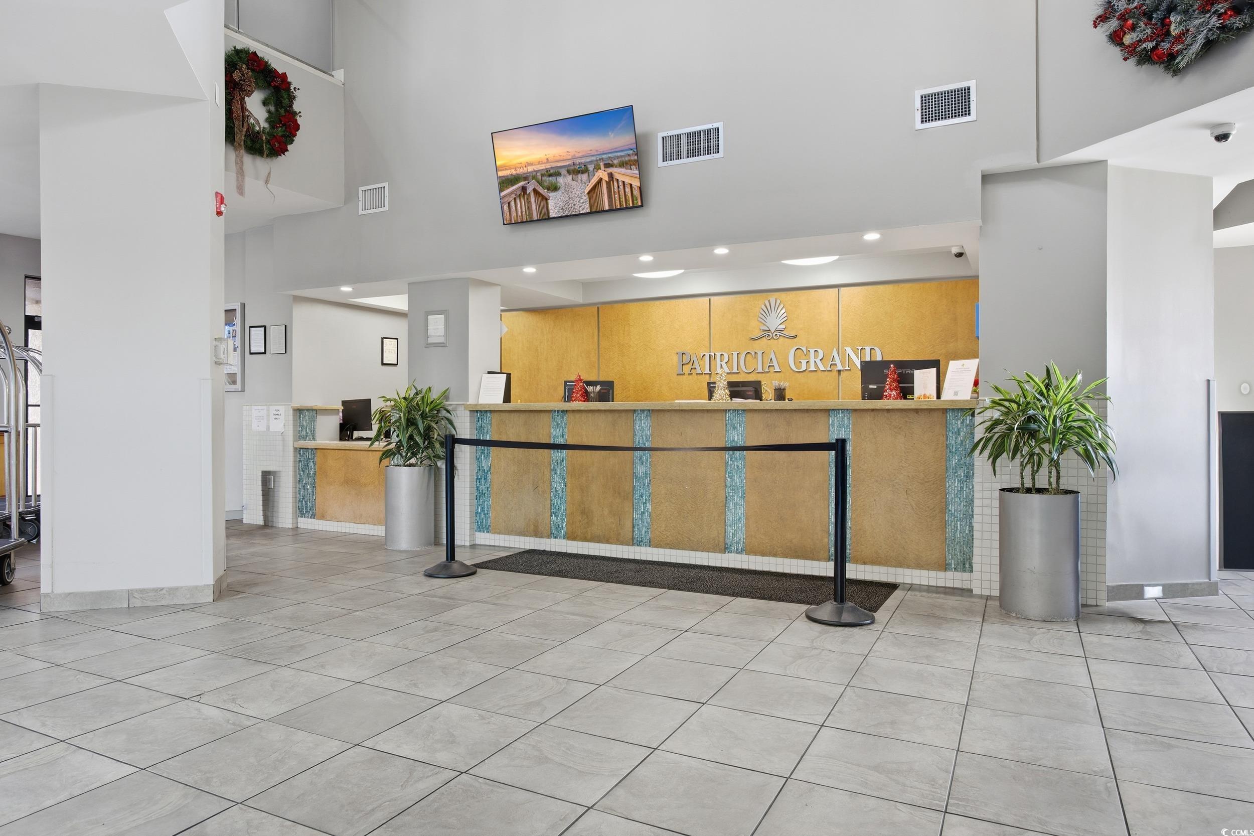 2710 North Ocean Boulevard, Unit 702 Myrtle Beach, SC 29577 - Photo 13 of 38 Welcome area featuring a high ceiling and recessed lighting