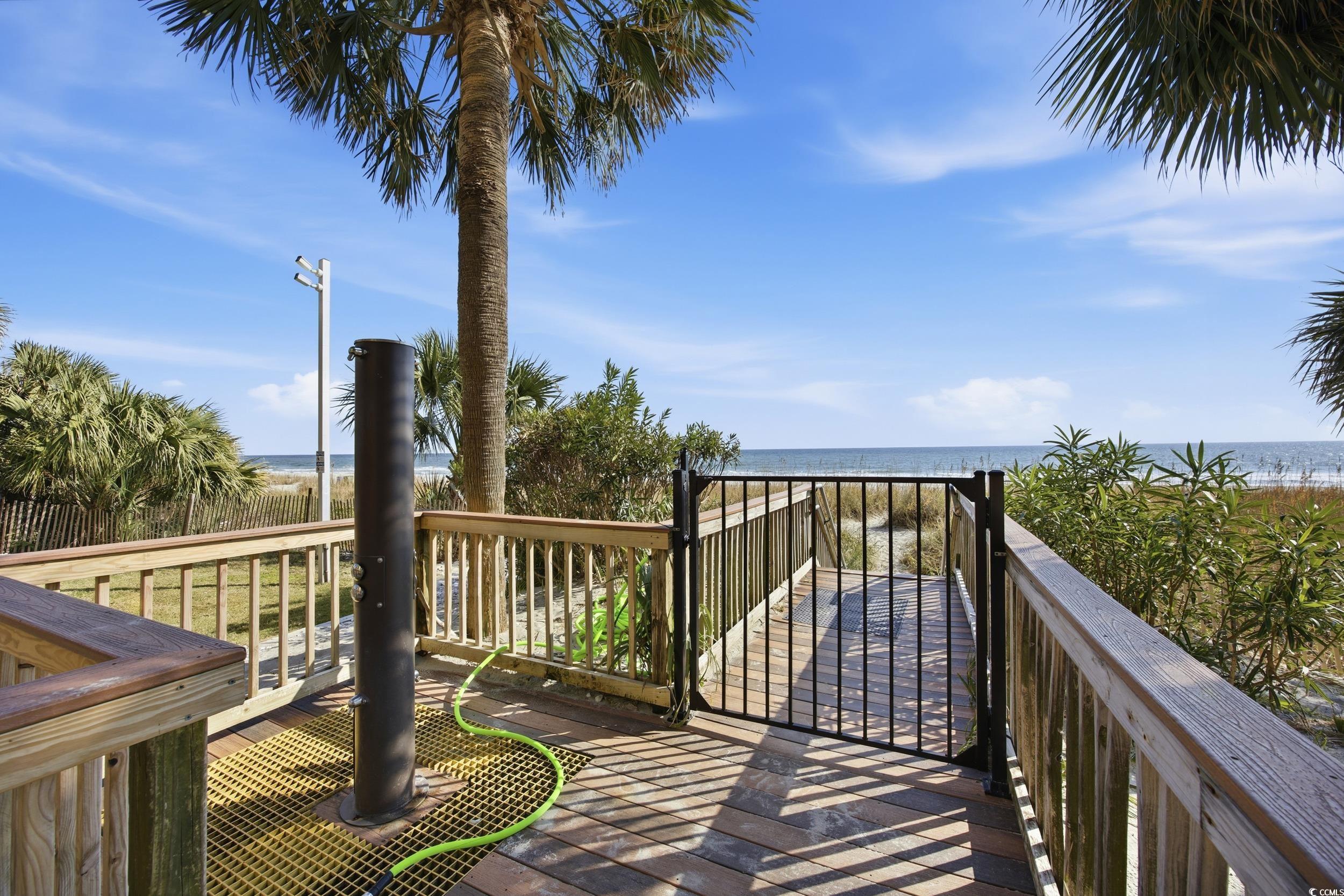 2710 North Ocean Boulevard, Unit 702 Myrtle Beach, SC 29577 - Photo 31 of 38 Deck with view of water and beach
