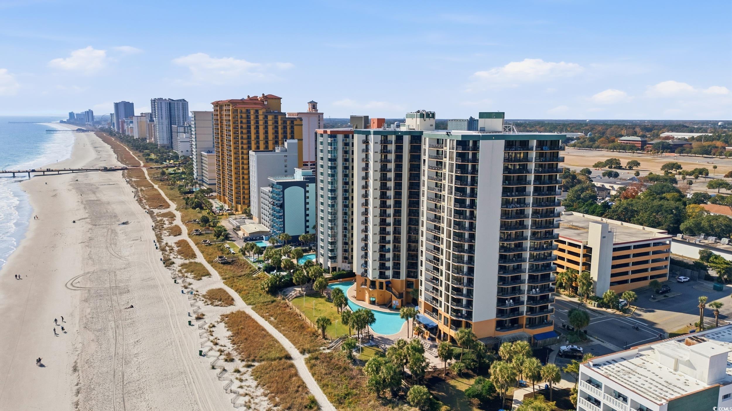 2710 North Ocean Boulevard, Unit 702 Myrtle Beach, SC 29577 - Photo 34 of 38 Aerial view of waterfront with a beach and skyline