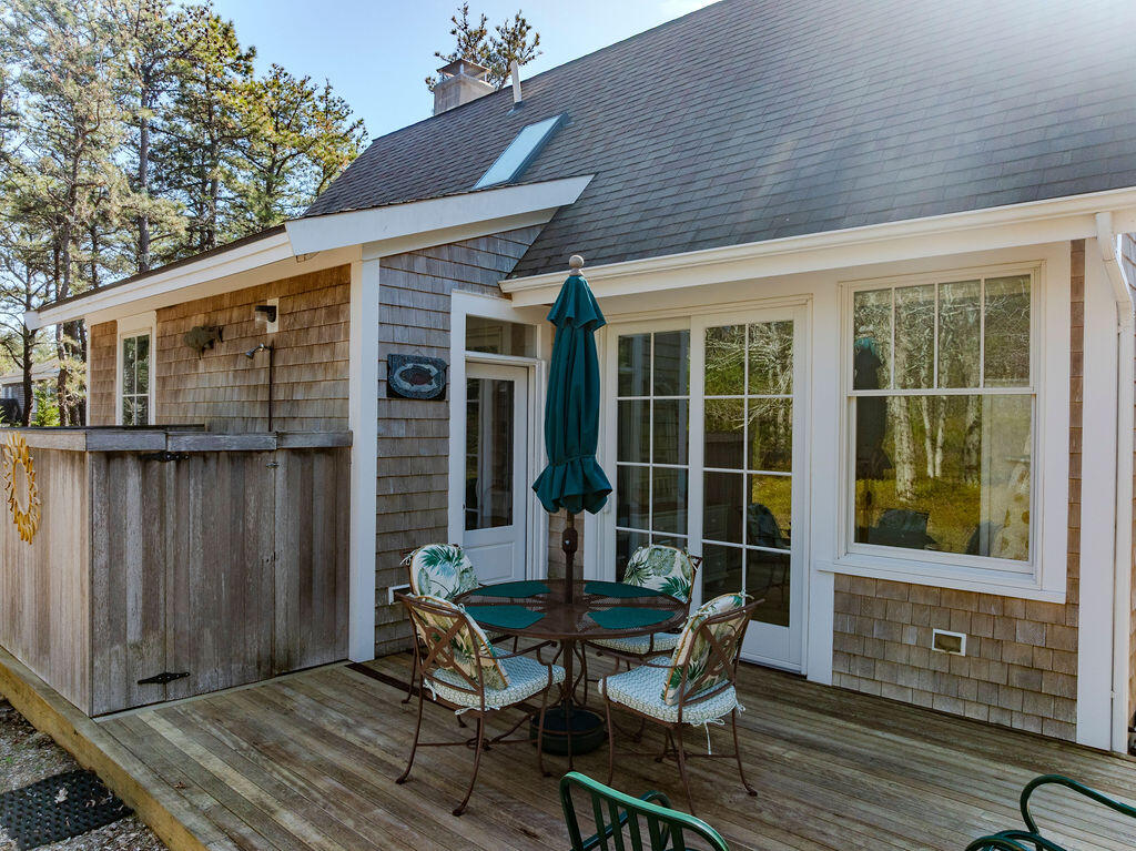 43 South Highland Road Truro, MA 02666 - Photo 24 of 40 a view of a house with backyard and sitting area