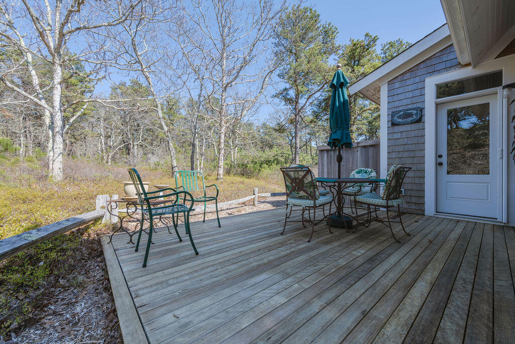43 South Highland Road Truro, MA 02666 - Photo 25 of 40 a view of a house with backyard and sitting area