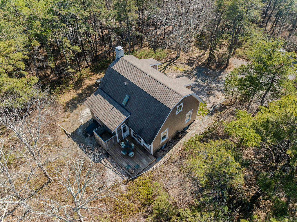 43 South Highland Road Truro, MA 02666 - Photo 29 of 40 an aerial view of house with yard and trees in the background