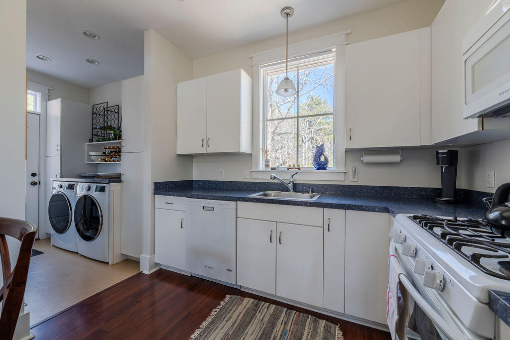 43 South Highland Road Truro, MA 02666 - Photo 10 of 40 a kitchen with a sink a stove and cabinets