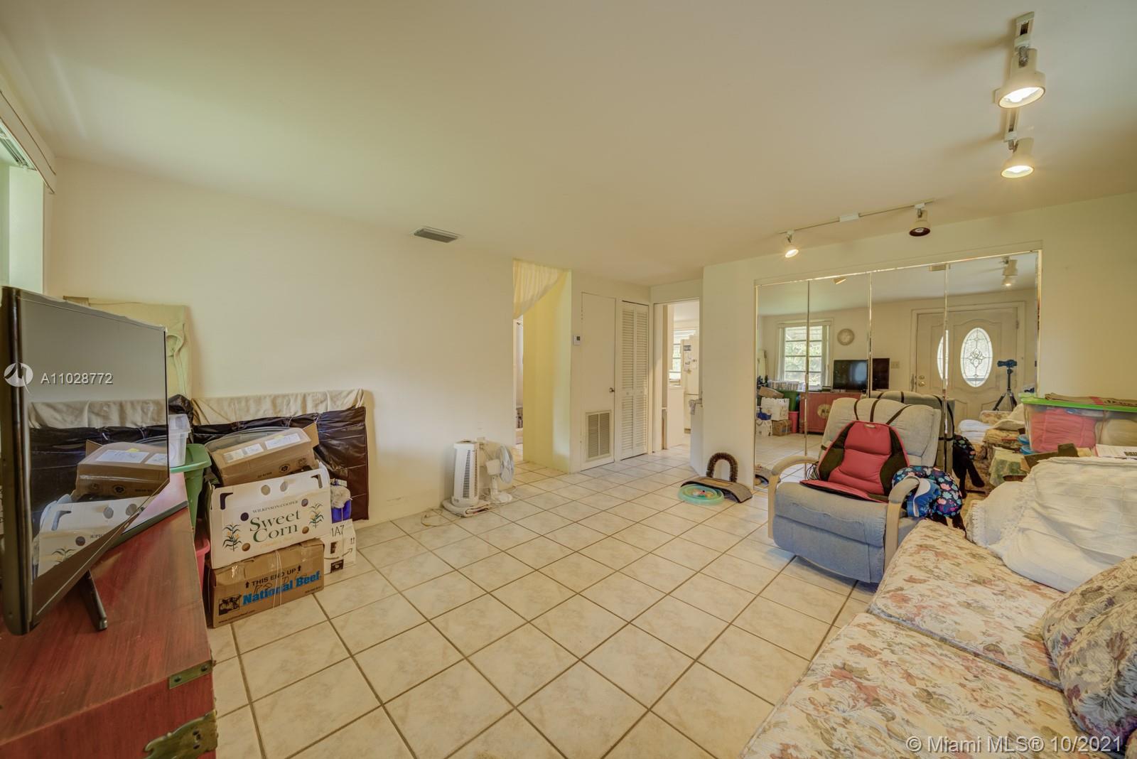a bedroom with furniture and wooden floor