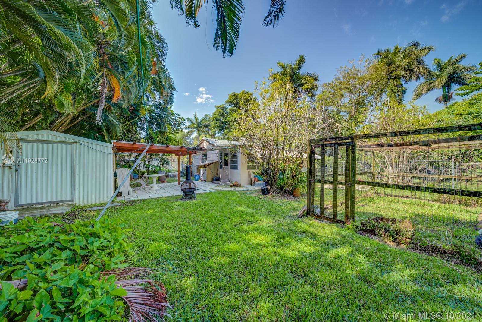 477 Northeast 154th Street Miami, FL 33162 - Photo 19 of 26 a view of backyard with a garden and entertaining space