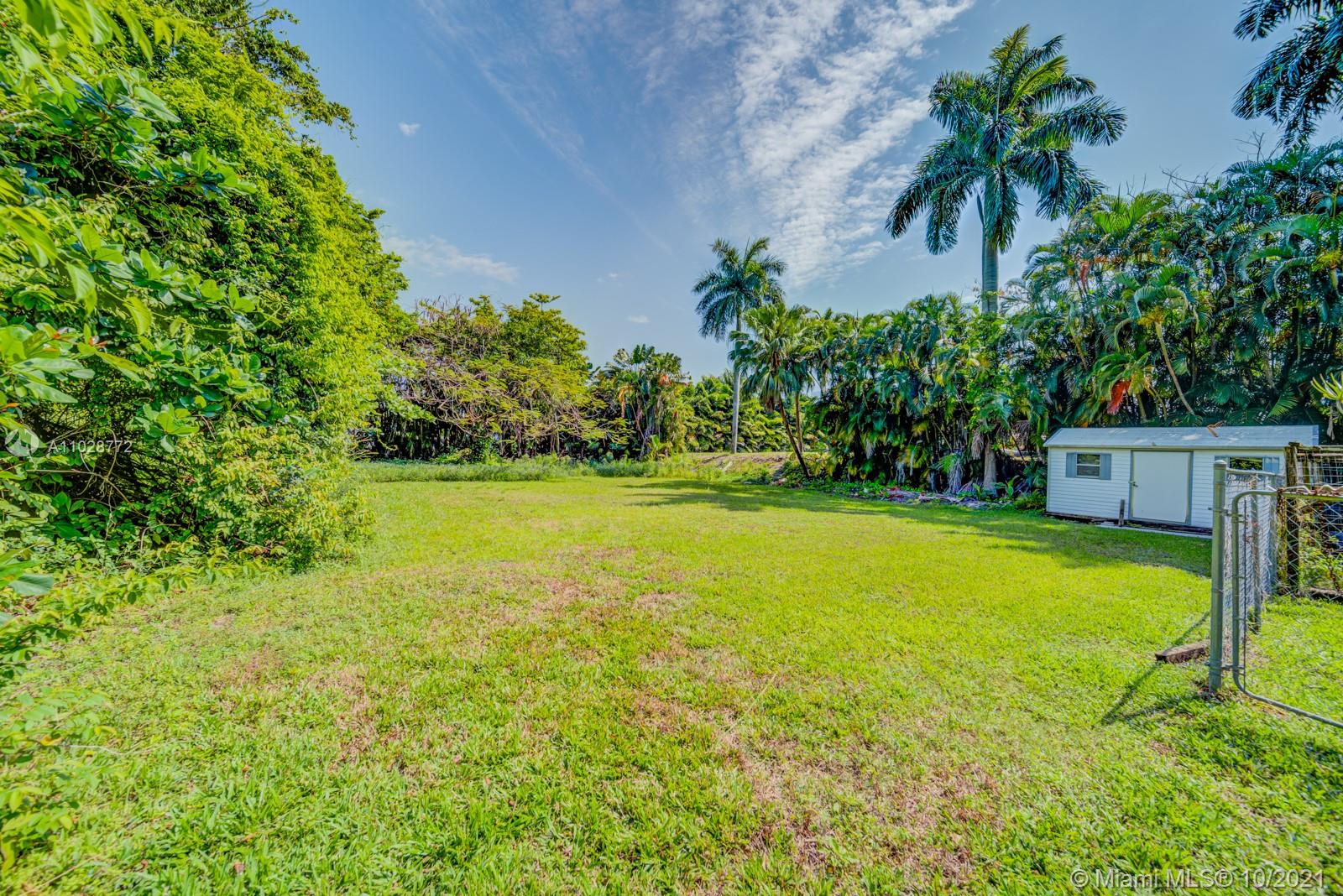 477 Northeast 154th Street Miami, FL 33162 - Photo 20 of 26 a view of a swimming pool with a yard