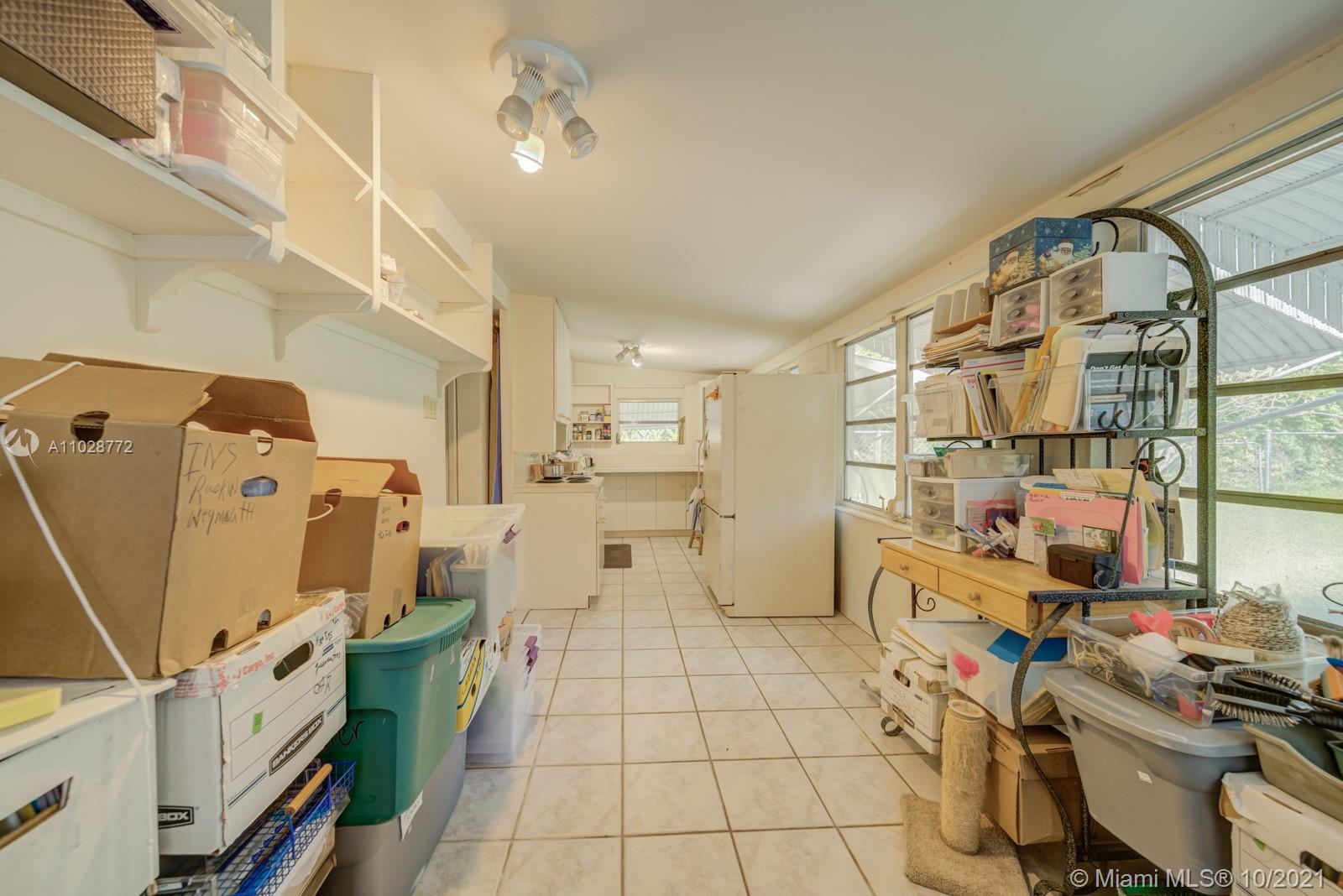 477 Northeast 154th Street Miami, FL 33162 - Photo 23 of 26 a room with storage and utility