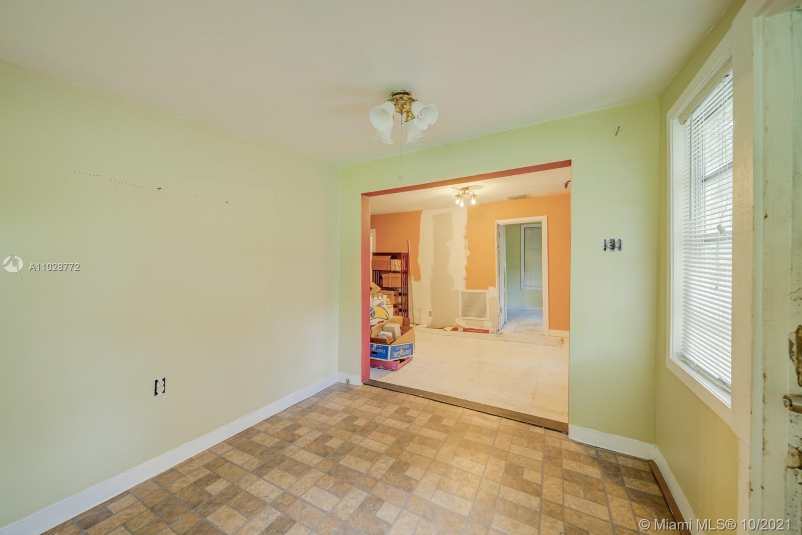 477 Northeast 154th Street Miami, FL 33162 - Photo 10 of 26 a view of an empty room with window