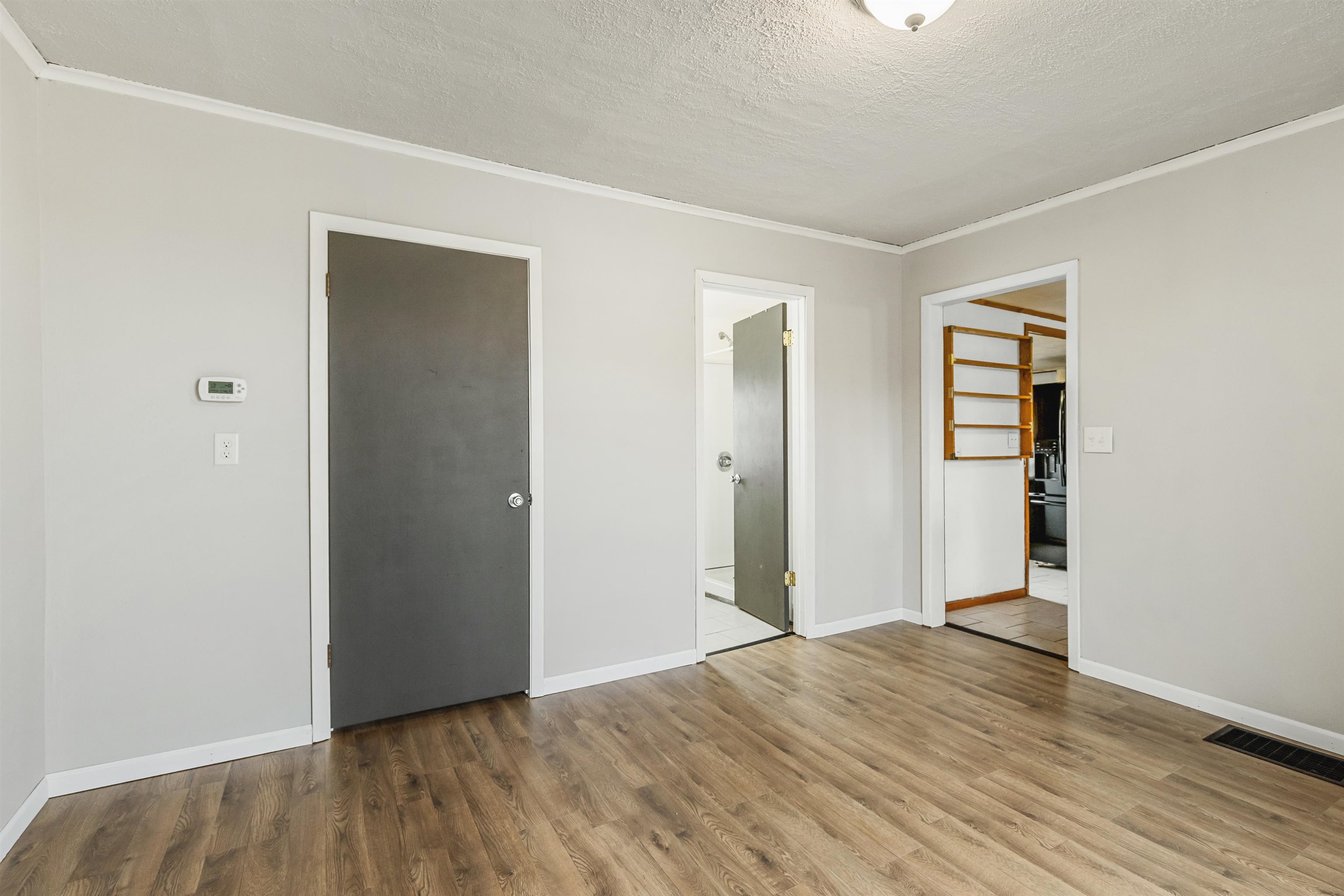 209 South Elida Street Winnebago, IL 61088 - Photo 14 of 48 a view of an empty room with wooden floor