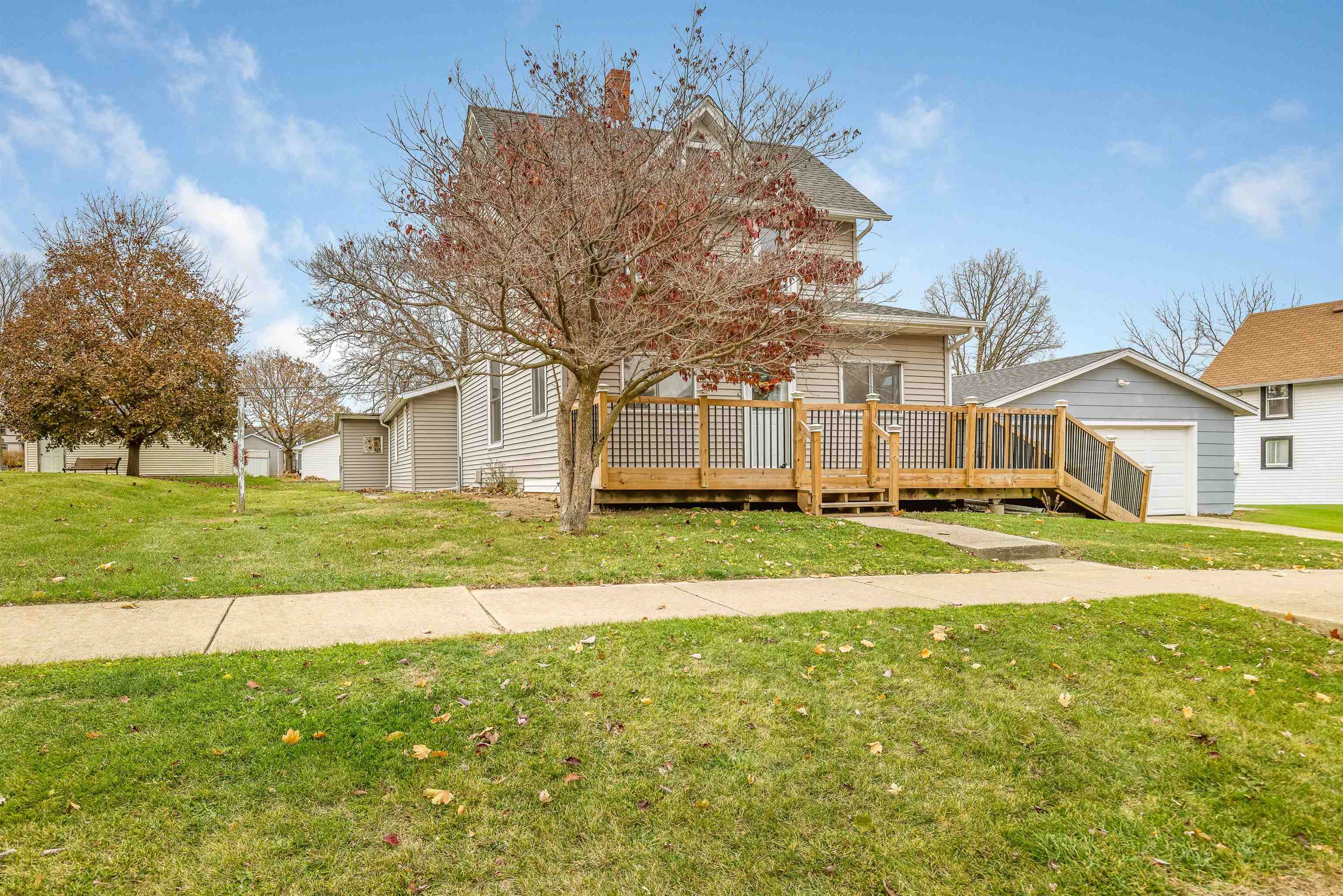 209 South Elida Street Winnebago, IL 61088 - Photo 2 of 48 a view of an house with swimming pool and a yard