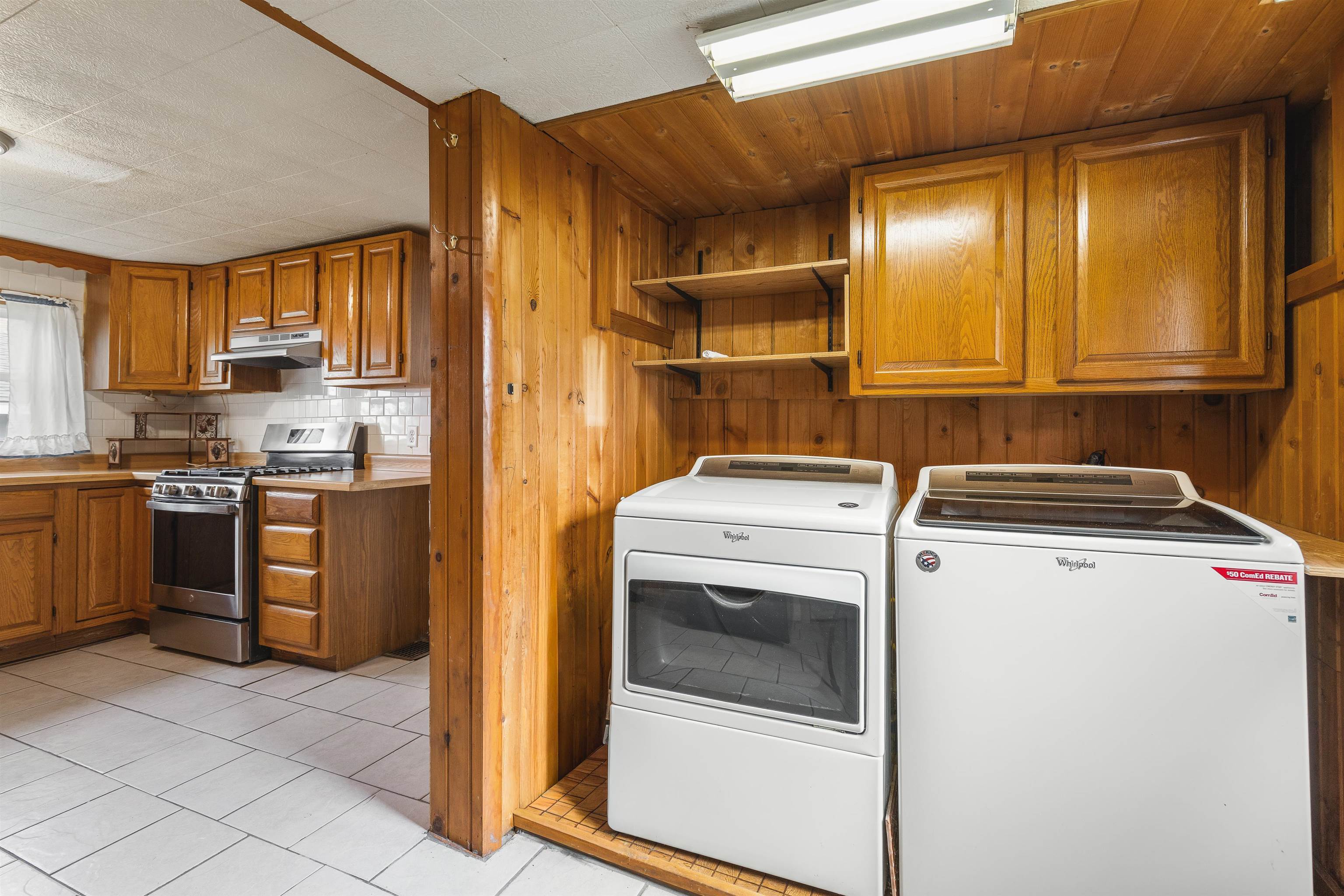 209 South Elida Street Winnebago, IL 61088 - Photo 23 of 48 a view of a kitchen with fridge and wooden floor