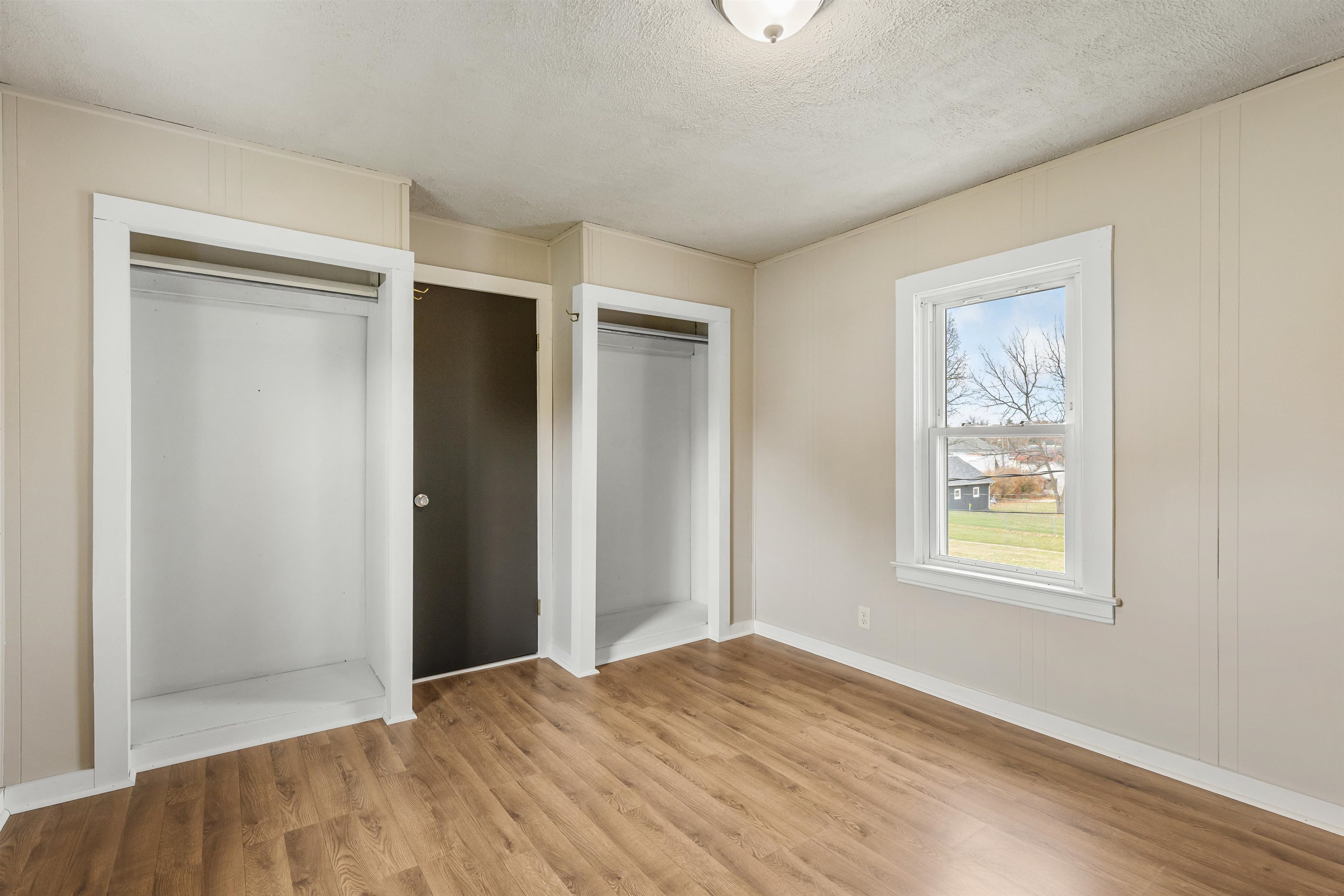 209 South Elida Street Winnebago, IL 61088 - Photo 26 of 48 a view of an empty room with wooden floor and a window