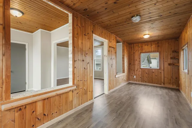 a view of hallway with wooden floor