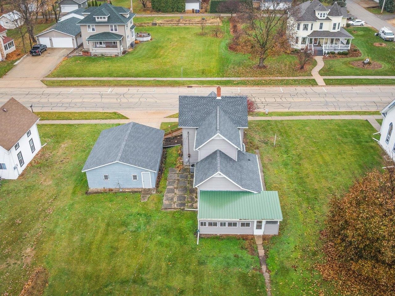 209 South Elida Street Winnebago, IL 61088 - Photo 43 of 48 an aerial view of residential houses with outdoor space and swimming pool