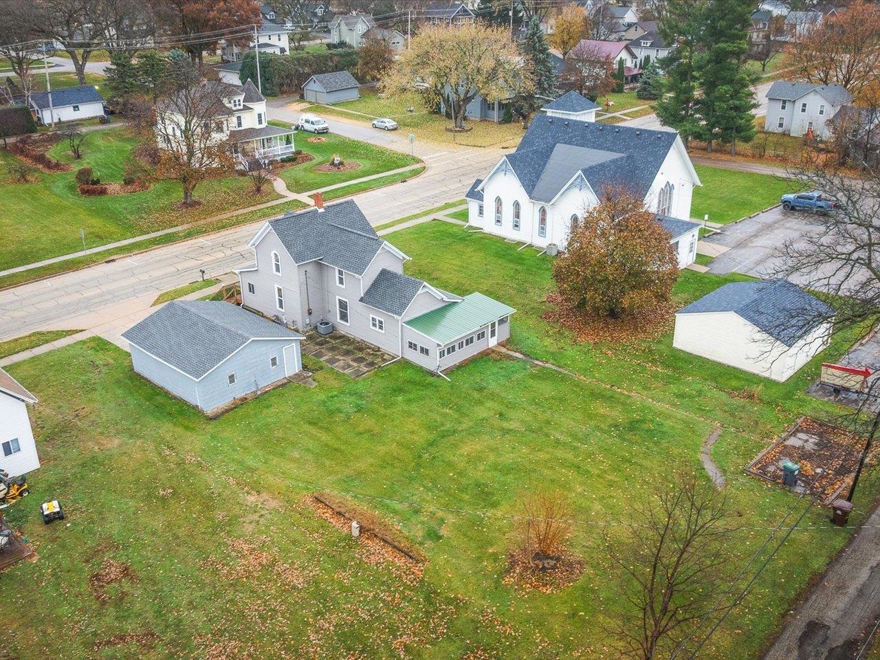 209 South Elida Street Winnebago, IL 61088 - Photo 45 of 48 an aerial view of a house with garden space and street view