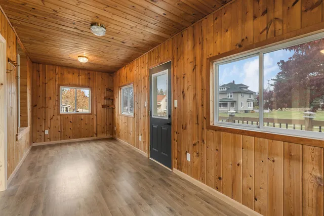 a view of an entryway with wooden floor